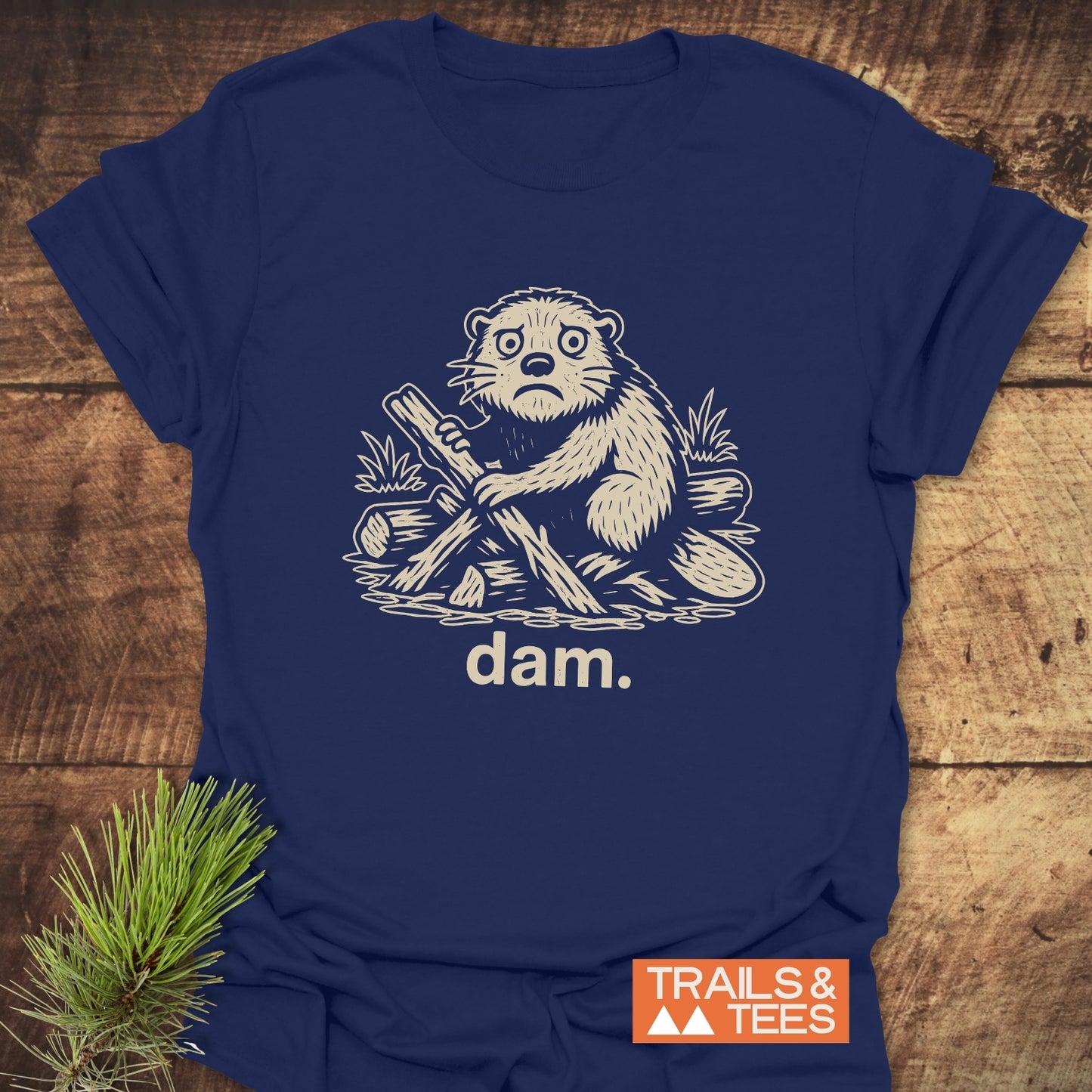 Beaver - Dam Funny T-Shirt featuring a beaver illustration, crafted from soft ring-spun cotton for comfort, with durable print and a TRAILS & TEES logo.