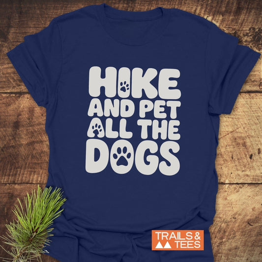 Navy blue Hike And Pet Dogs T-shirt with playful white bubble text and paw prints, featuring durable, comfortable fabric, perfect for outdoor enthusiasts.