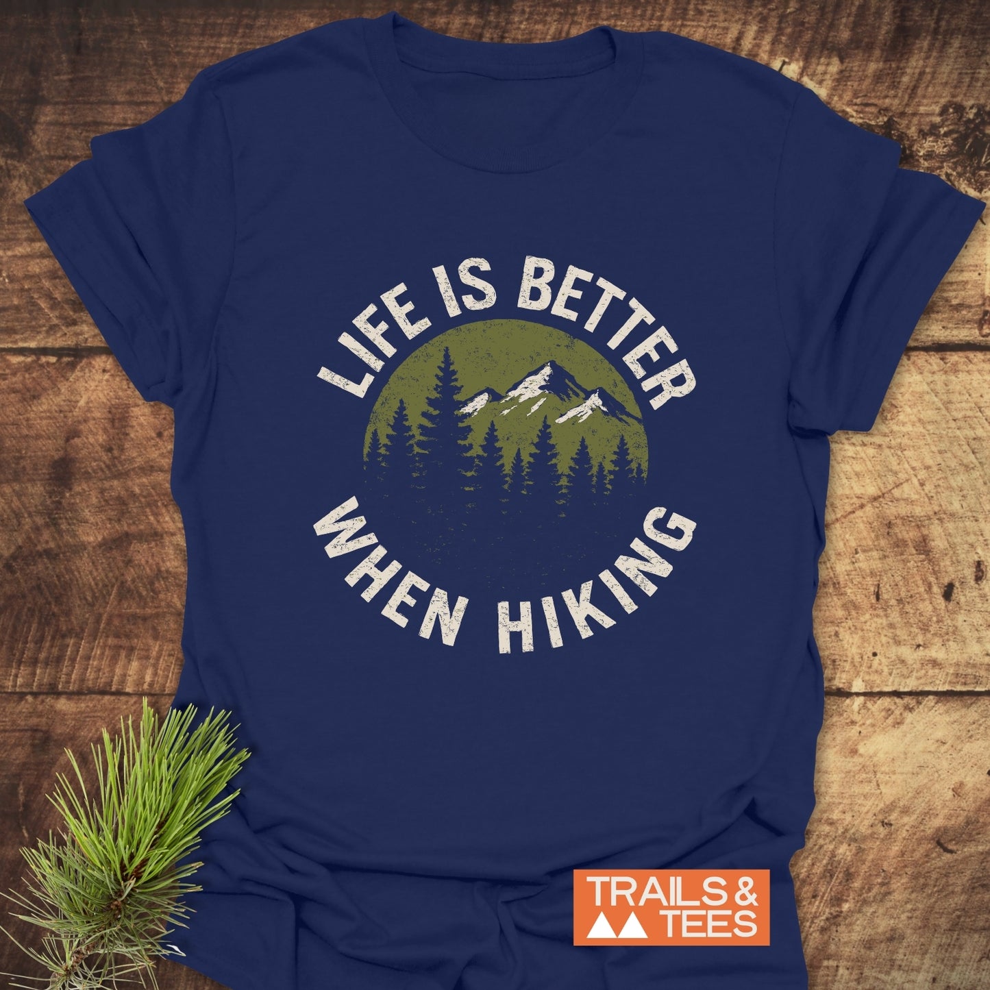 Life Is Better When Hiking T-Shirt with mountain and forest graphic, showcasing durable print on soft cotton, ideal for outdoor enthusiasts.