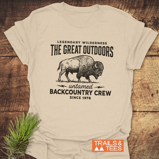 The Great Outdoors T-Shirt features a vintage bison print and text, styled with a pine sprig; crafted from soft, ring-spun cotton.