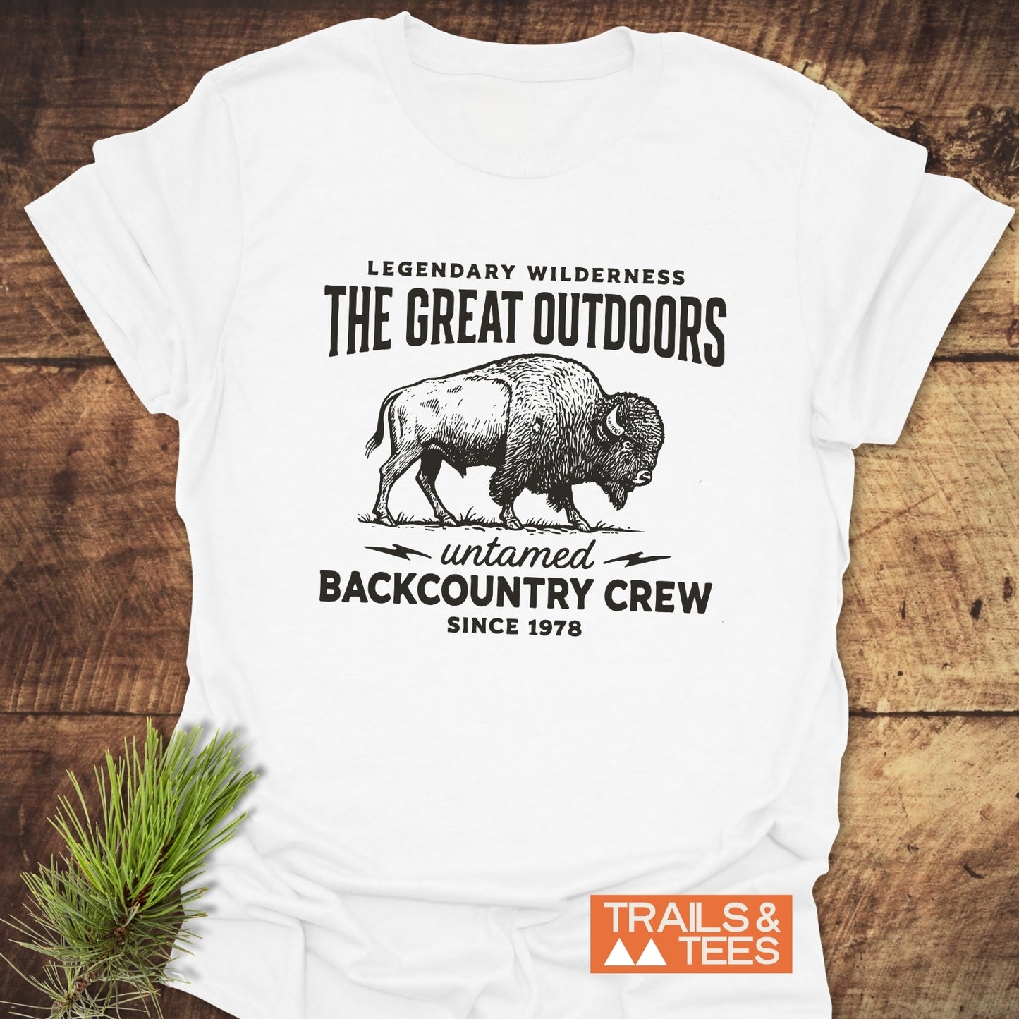 The Great Outdoors T-Shirt features a bison illustration and wilderness-themed text, offering comfort and durability with ring-spun cotton and a rustic design.