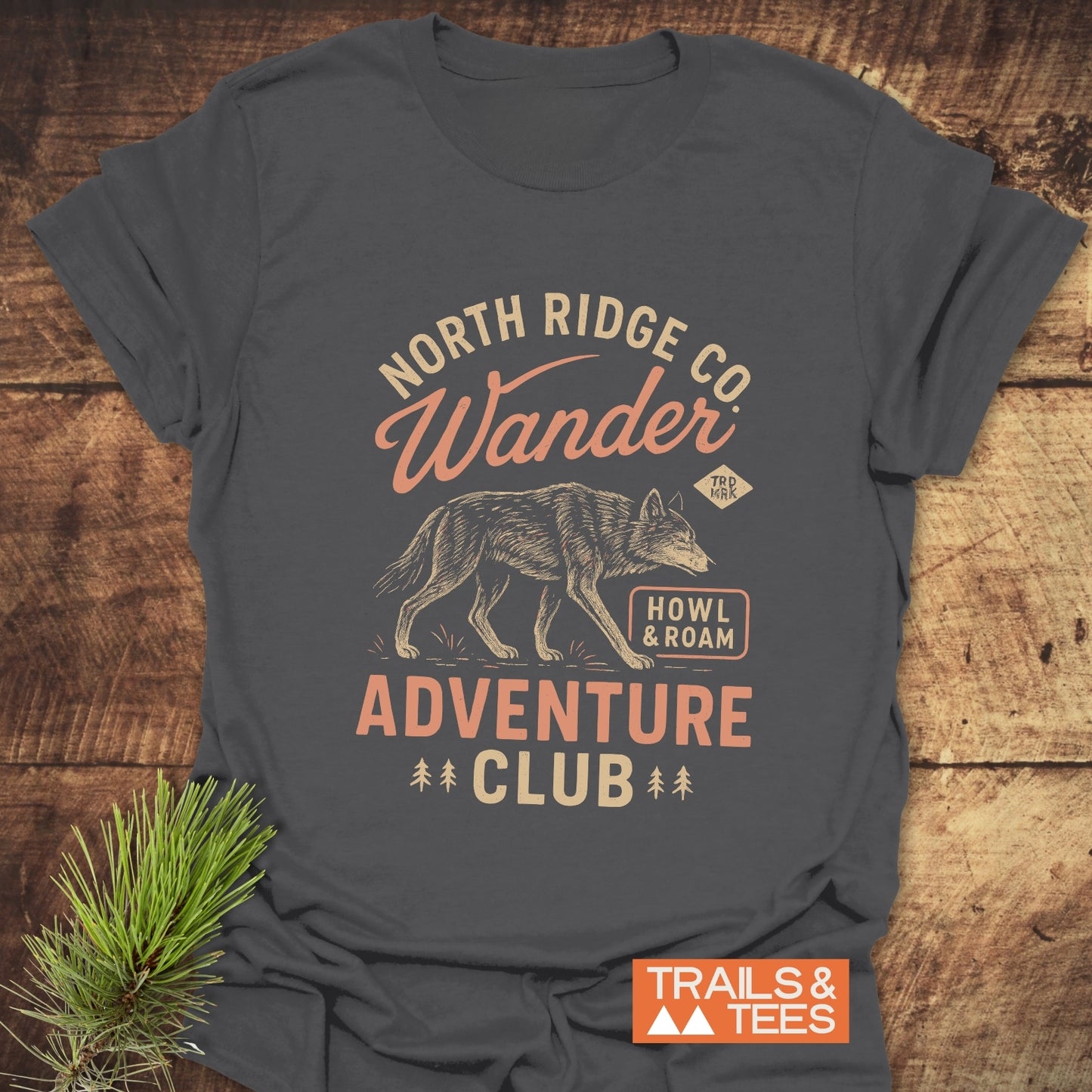 Howl And Roam Wolf T-Shirt featuring a nature motif with NORTH RIDGE CO., Wander, wolf illustration, and ADVENTURE CLUB text on soft, lightweight cotton.