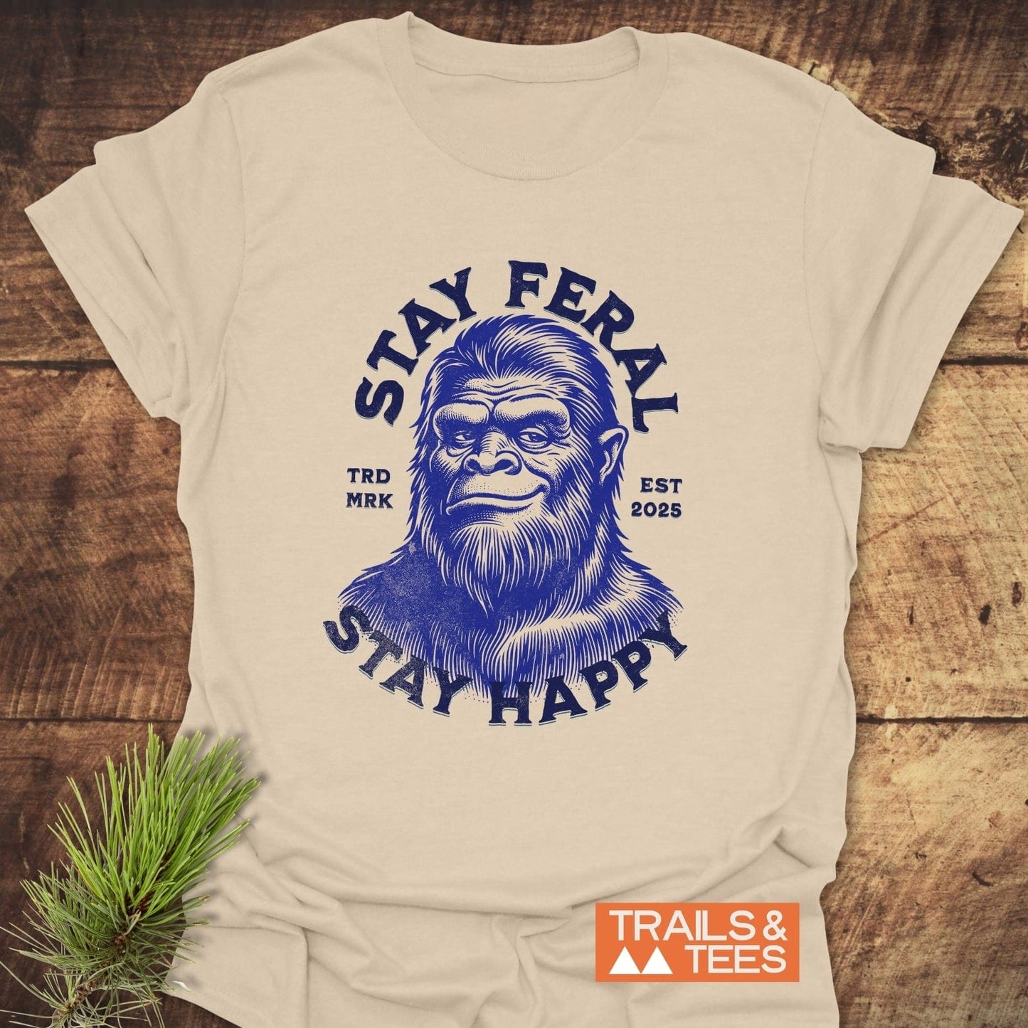 Stay Feral, Stay Happy T-Shirt featuring Bigfoot face and slogan, designed for comfort and adventure with durable prints and a reliable fit.