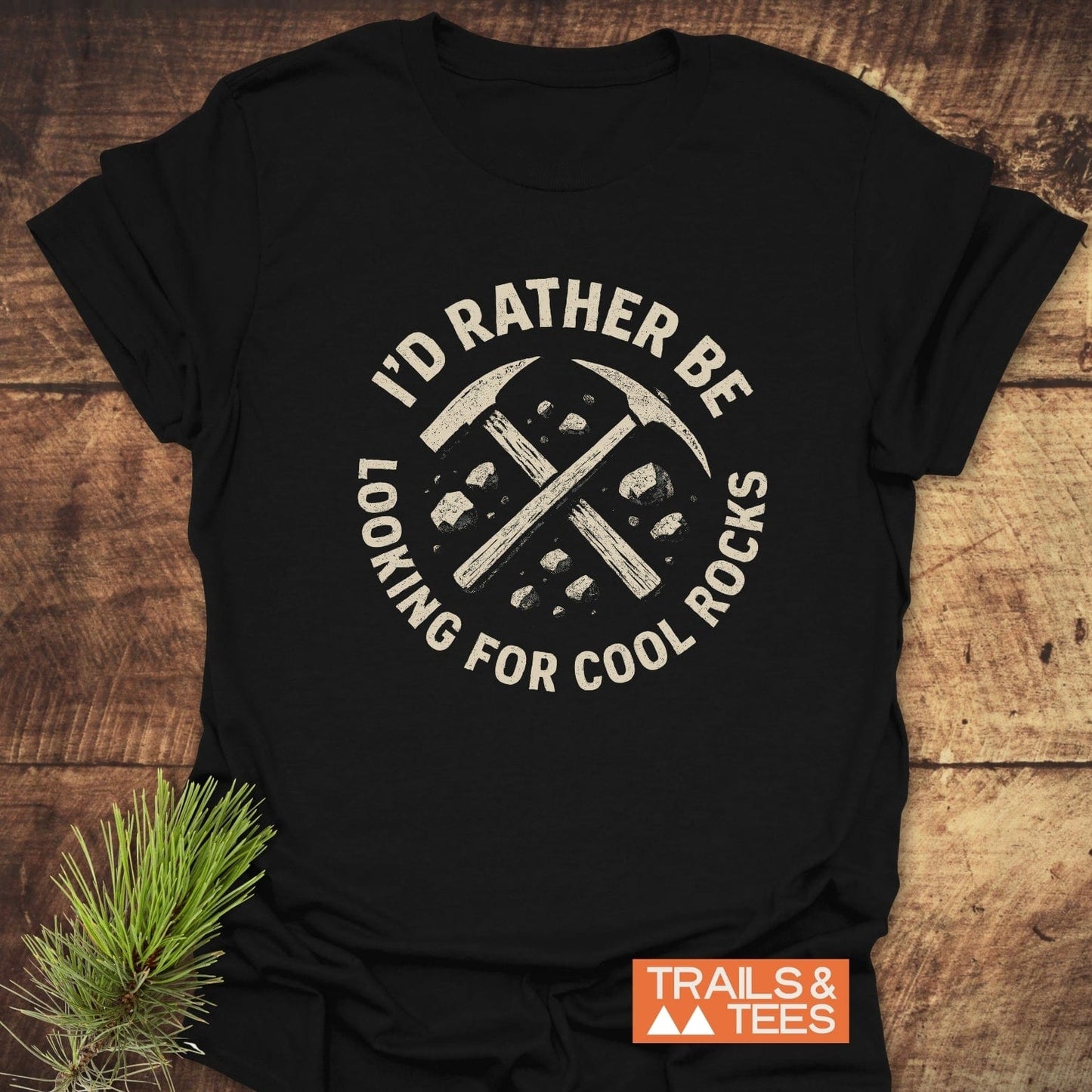 I'd Rather... Rocklover T-Shirt: Black tee featuring a circular graphic with pickaxes and stones, perfect for outdoor enthusiasts, crafted from soft, lightweight cotton.