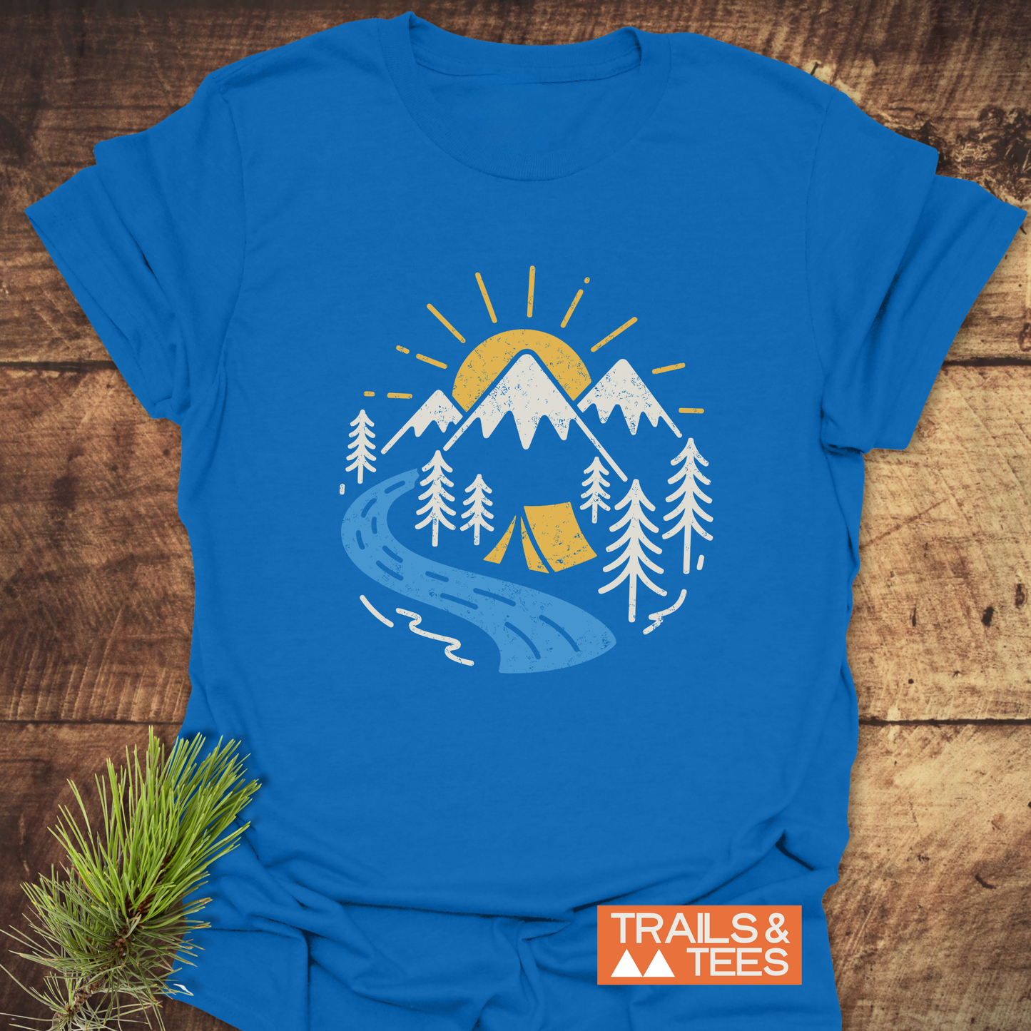 Camping Love T-Shirt with a mountain scene, yellow sun, river, pine trees, and tent. Crafted for comfort, featuring durable prints and pre-shrunk ring-spun cotton.