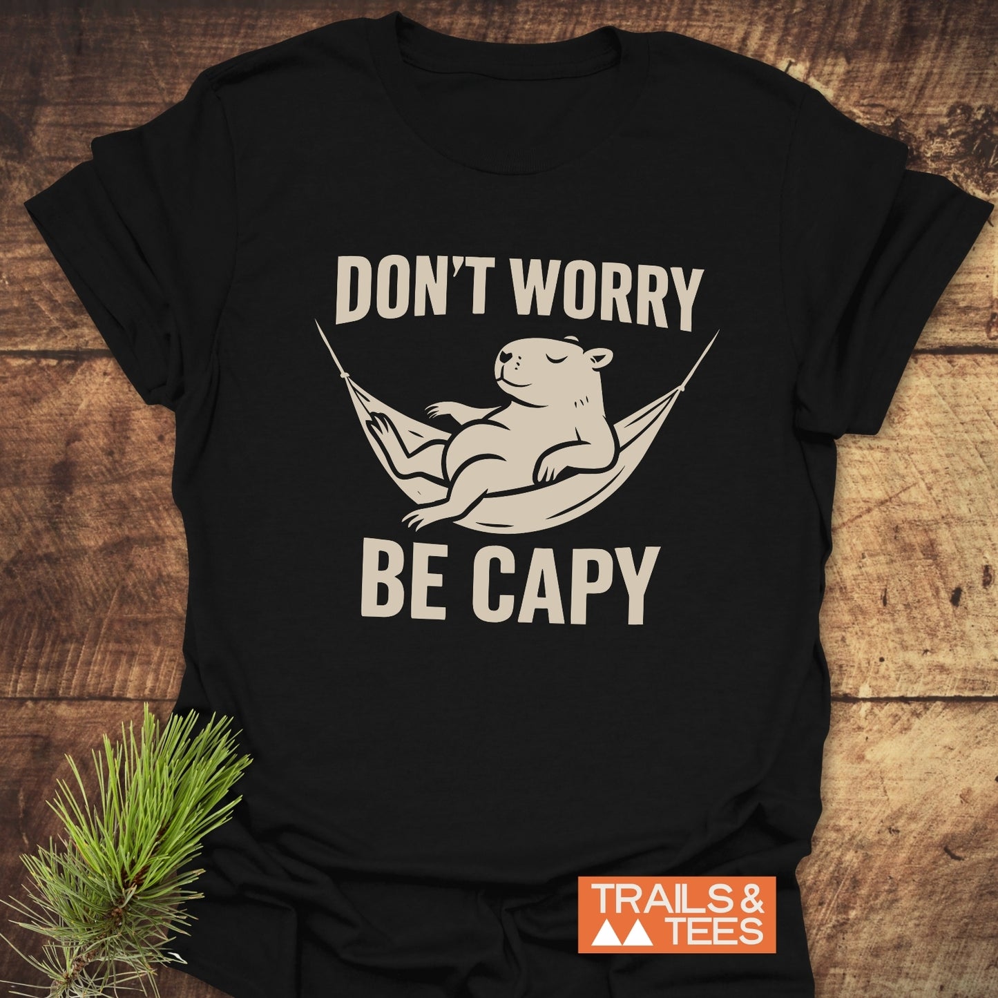 Don't Worry Capybara T-Shirt featuring a lounging capybara graphic, emphasizing comfort and adventure, made of soft cotton for durability and everyday wear.