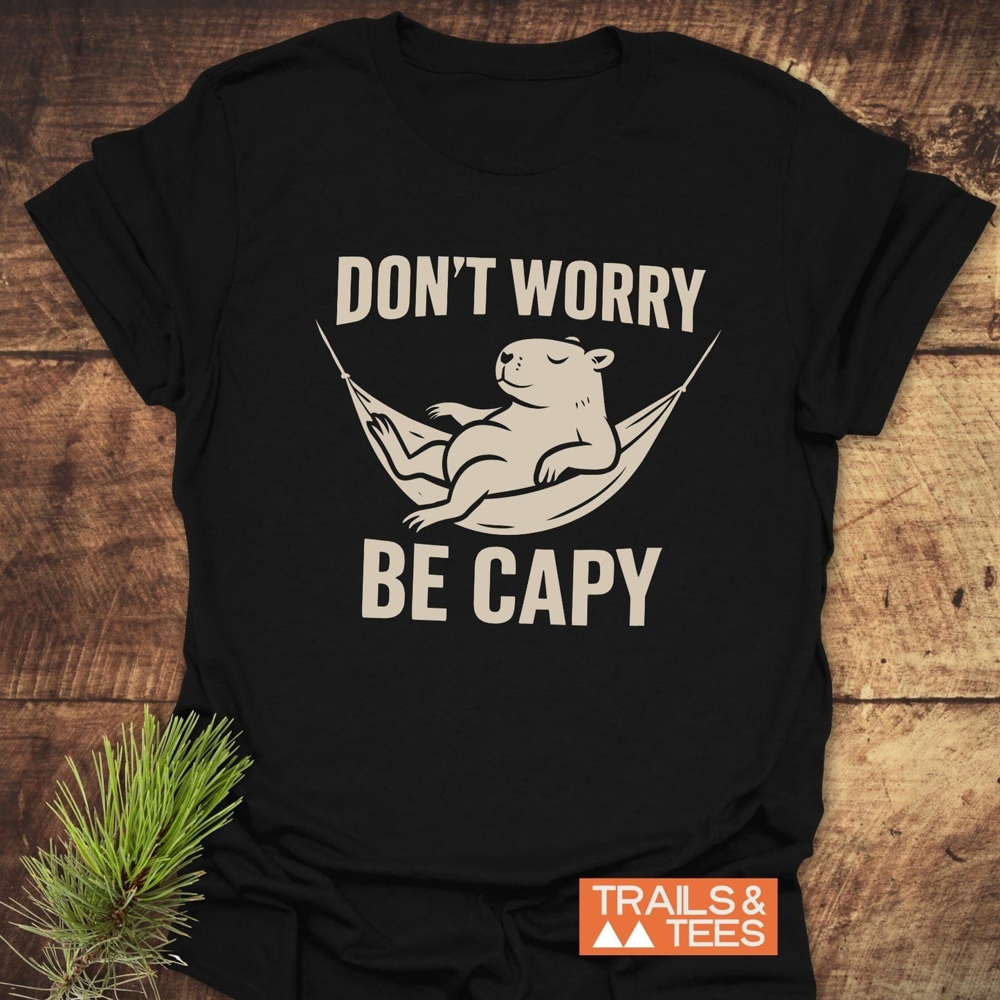 Don't Worry Capybara T-Shirt featuring a lounging capybara graphic, emphasizing comfort and adventure, made of soft cotton for durability and everyday wear.
