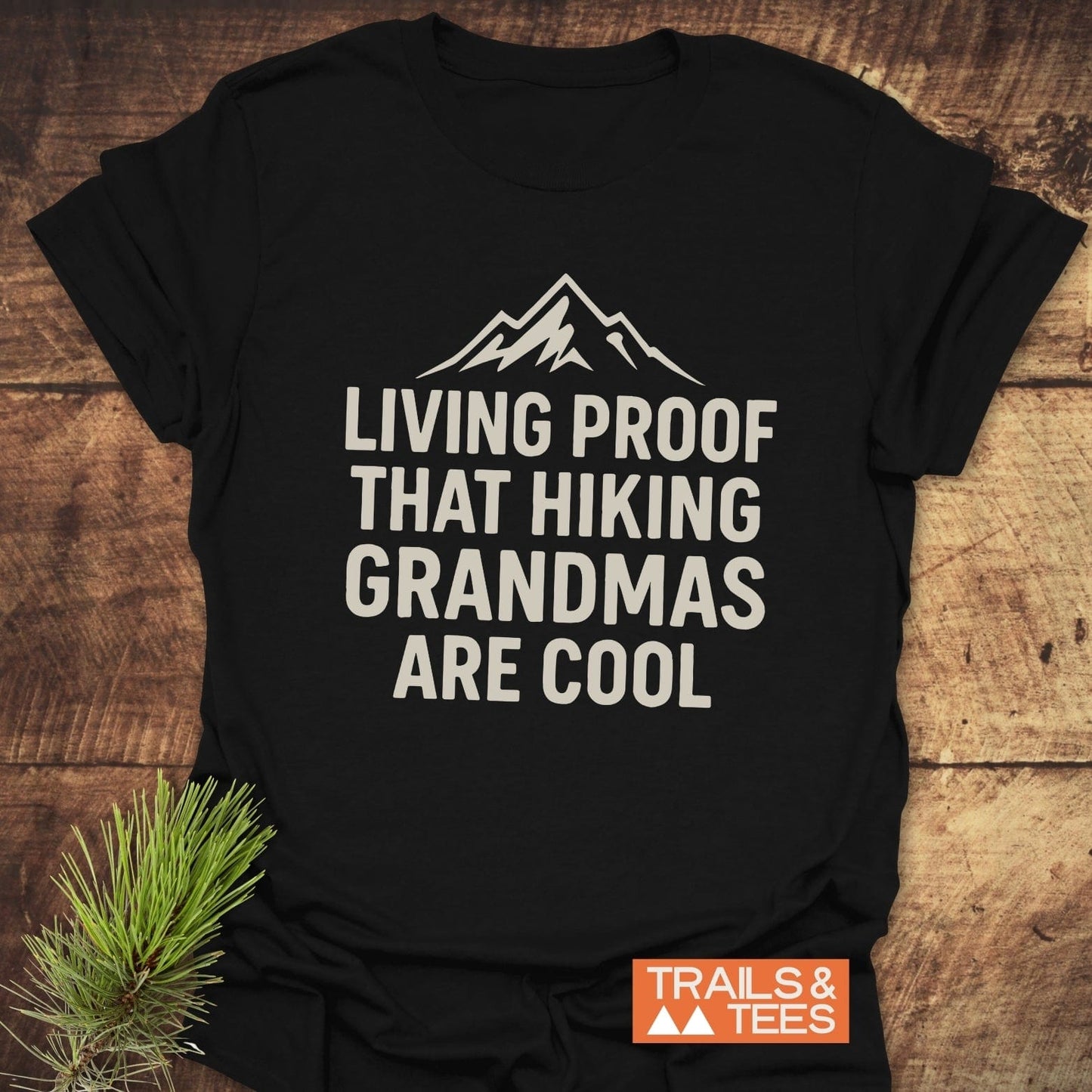 Living Proof Grandma T-Shirt with mountain graphic and text, designed for hiking enthusiasts. Features durable print, soft cotton, and nature-themed accents.