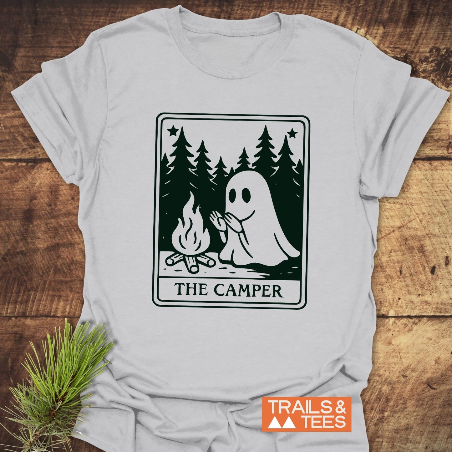 The Camper Retro Tarot T-Shirt features a ghost by a campfire graphic, designed for comfort and adventure, with durable prints and a reliable fit.