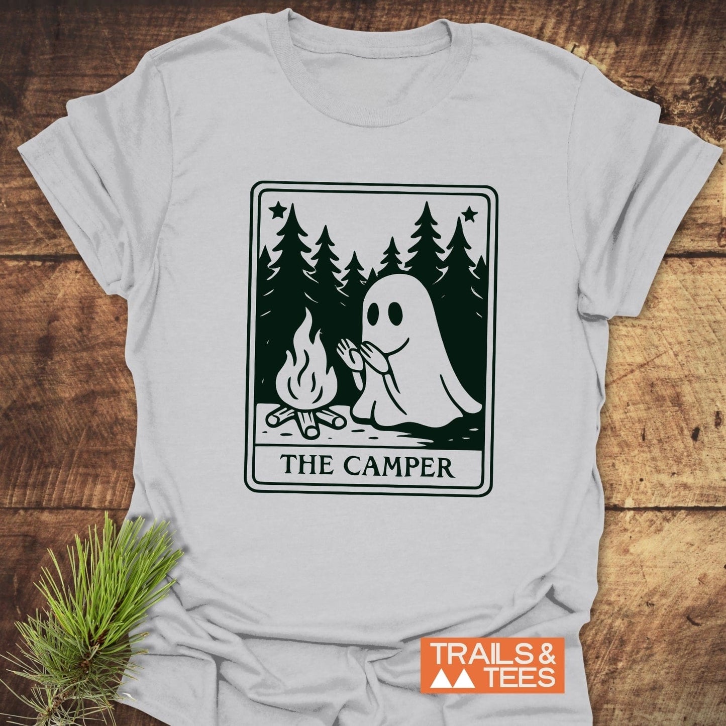 The Camper Retro Tarot T-Shirt features a ghost by a campfire graphic, designed for comfort and adventure, with durable prints and a reliable fit.