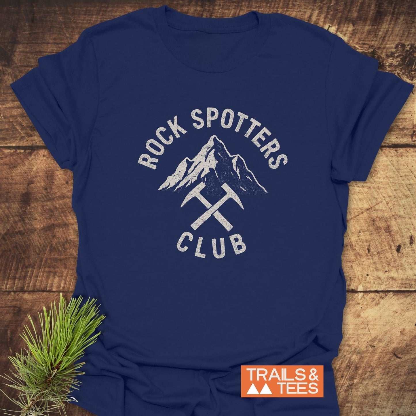Rock Spotters Club T-Shirt with mountain peak graphic and crossed rock-hammers, crafted from soft cotton for everyday adventure, featuring durable prints and reliable fit.