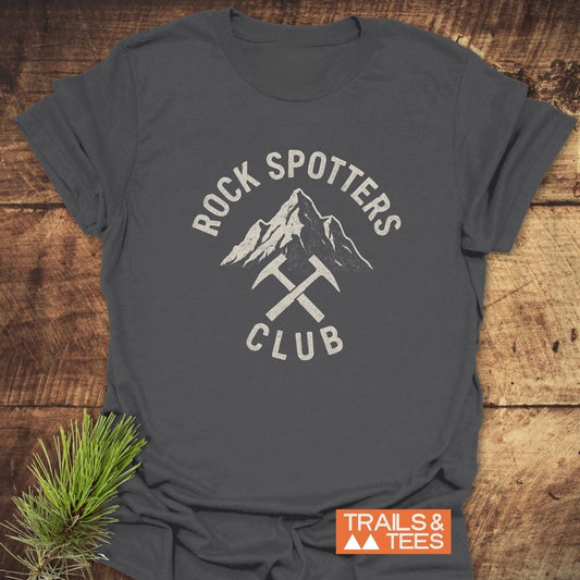 Rock Spotters Club T-Shirt: Dark-gray tee with a white mountain peak and ice-axes graphic, featuring durable prints and soft, ring-spun cotton for outdoor enthusiasts.