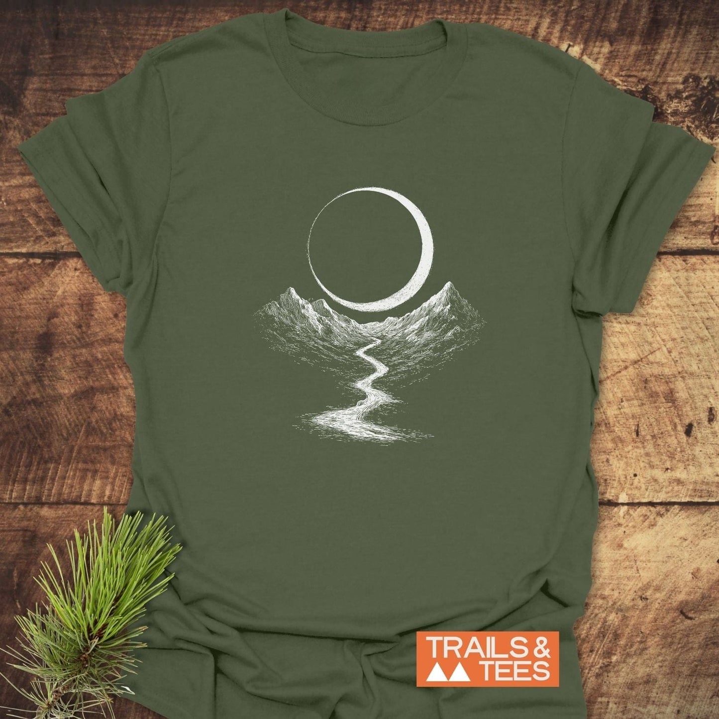 Eclipse Trail T-Shirt featuring a crescent moon and mountains design, crafted from soft, lightweight cotton for comfort and adventure-ready durability.