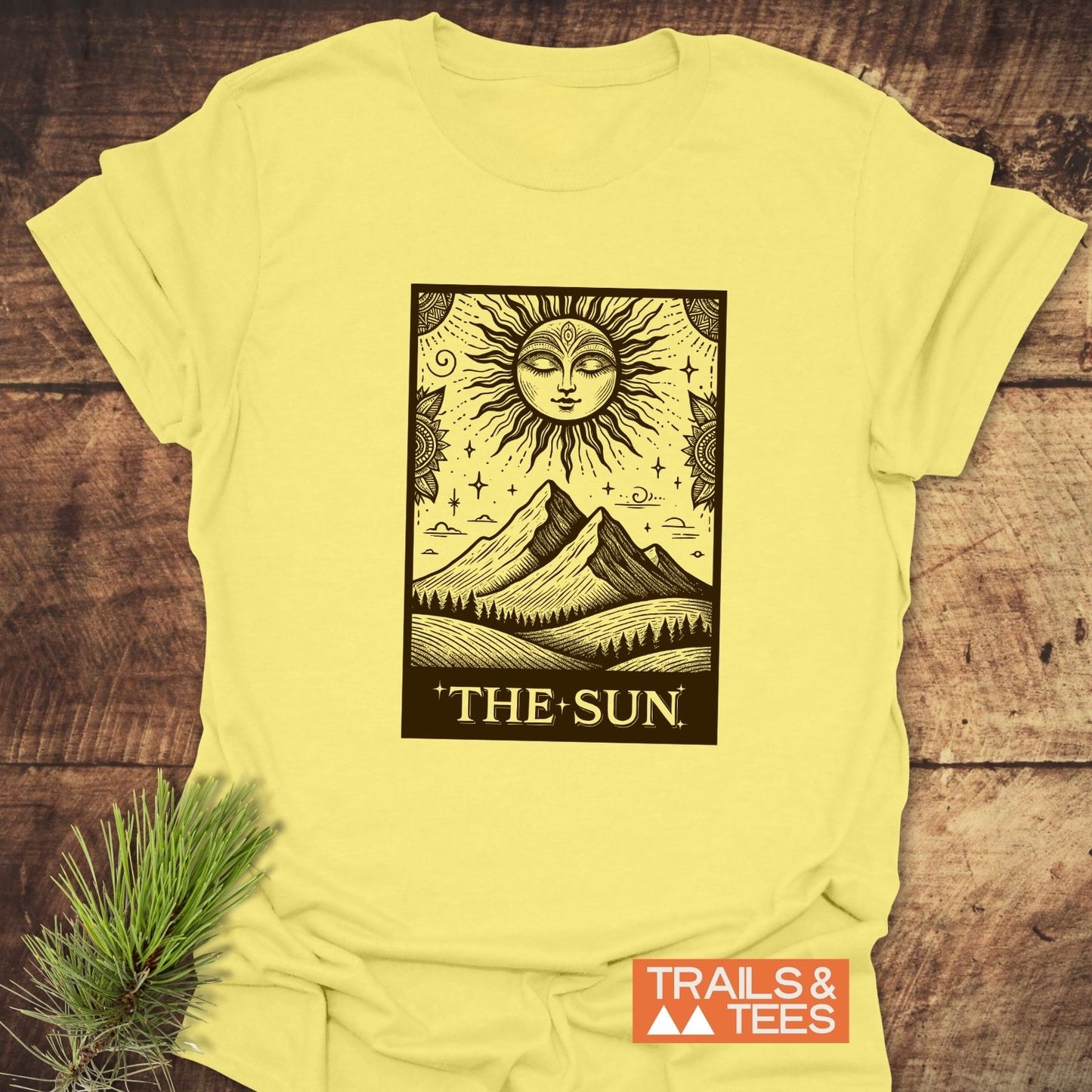 The Sun Tarot T-Shirt features a bold tarot-style sun illustration, crafted from soft ring-spun cotton for comfort and durability.