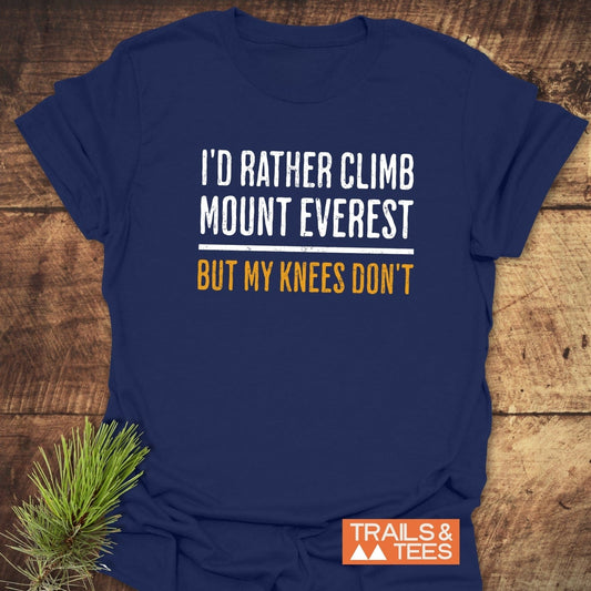 Navy T-shirt with I'D RATHER CLIMB MOUNT EVEREST text in white and orange. TRAILS & TEES logo displayed.