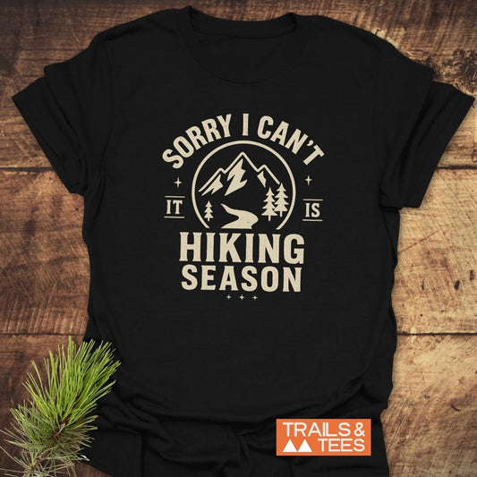 620 Hiking Season T-Shirt featuring off-white lettering and mountain graphics, made from soft ring-spun cotton, perfect for outdoor enthusiasts seeking comfort and style.