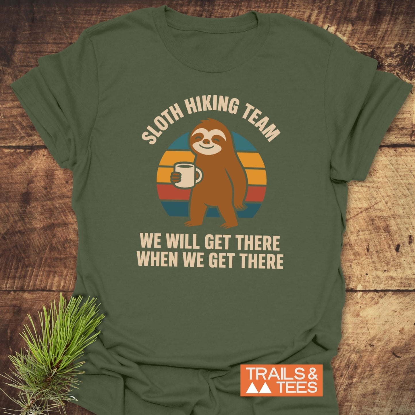 Sloth Hiking Team T-Shirt featuring a smiling sloth with coffee, crafted from soft cotton, durable print, and designed for outdoor enthusiasts.