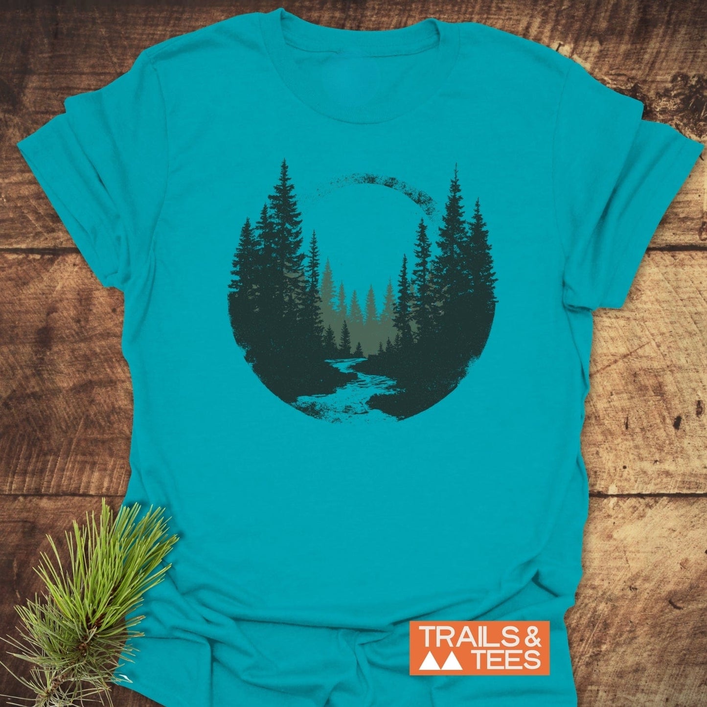 Woodland Peace T-Shirt with a forest graphic, showcasing trail-tested comfort and eco-friendly production. Ideal for outdoor enthusiasts, featuring durable, pre-shrunk cotton.