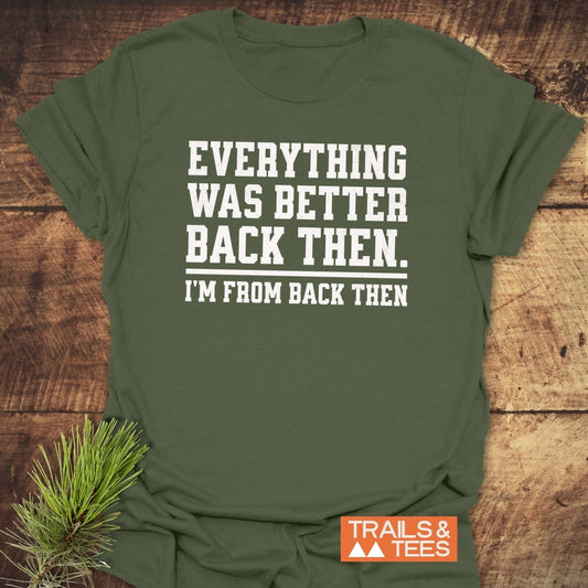 Back Then Funny T-Shirt in olive green with white slogan, styled with pine branch, showcases comfort and durability for outdoor enthusiasts.