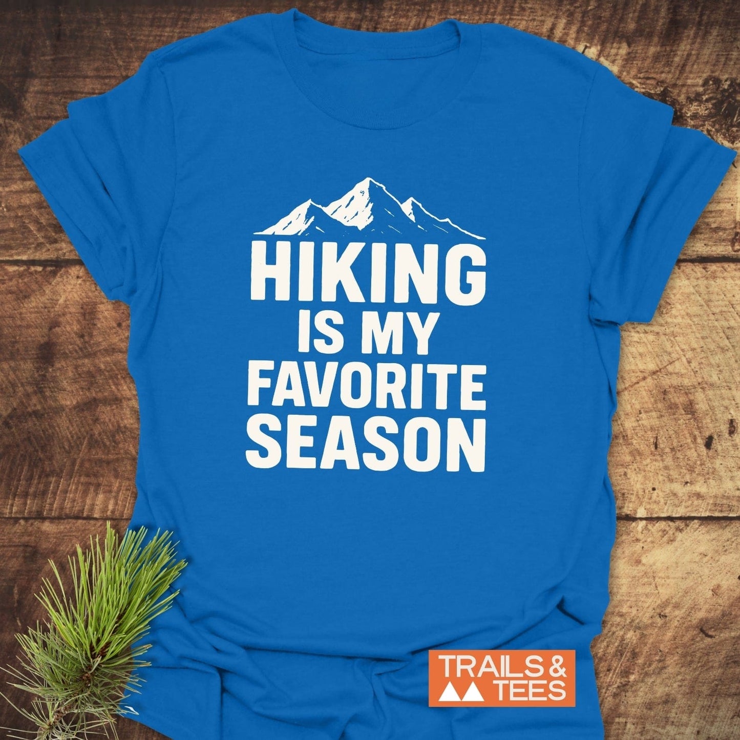 Hiking Is My Favorite Season T-Shirt with mountain graphic and Trails & Tees logo, crafted from lightweight cotton, showcasing outdoor enthusiasm with durable, pre-shrunk design.