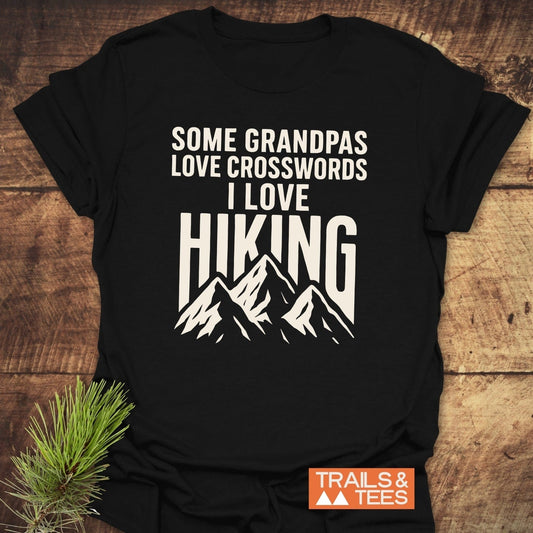 Black T-shirt featuring Grandpa Loves Hiking text and mountain graphic, highlighting its soft, durable design by Trails & Tees, perfect for outdoor enthusiasts.