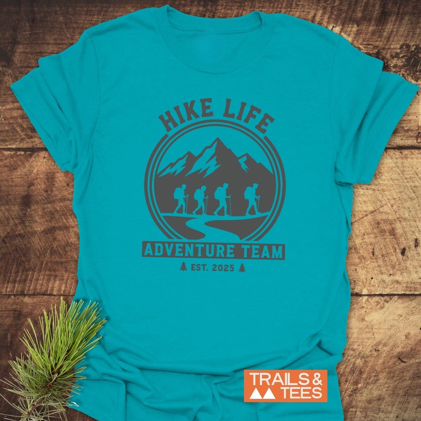 Adventure Team T-Shirt featuring hikers and mountains graphic, “HIKE LIFE” text. Soft, pre-shrunk ring-spun cotton, durable prints, seamless design.