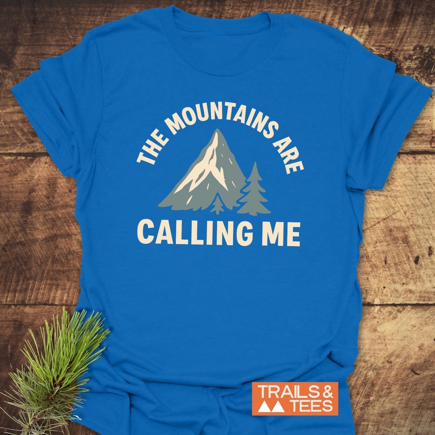 Mountains Calling Me T-Shirt featuring a mountain graphic and slogan, crafted from lightweight, soft cotton for comfort and adventure enthusiasts.