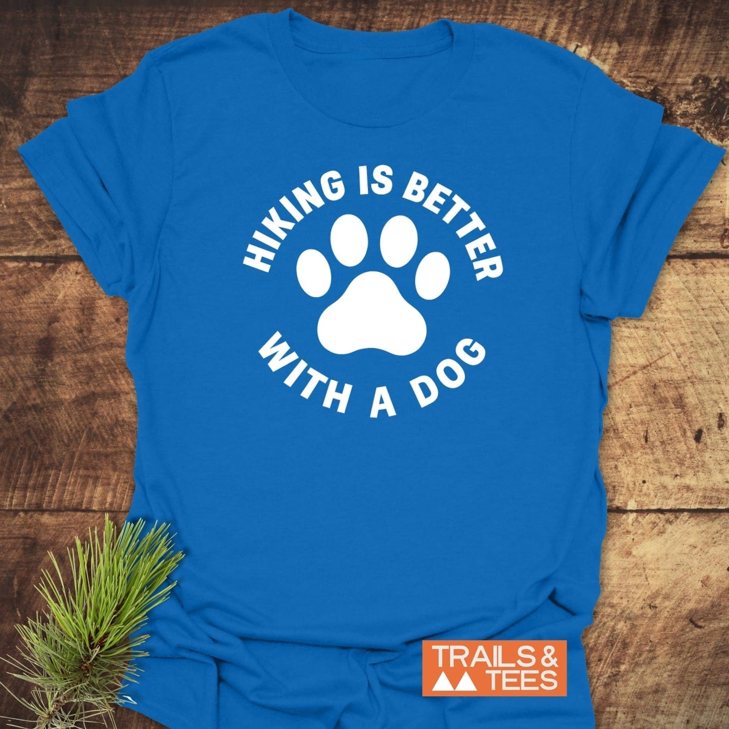 Hiking With Dogs T-Shirt featuring a white paw print and slogan on soft, lightweight ring-spun cotton, ideal for outdoor enthusiasts seeking comfort and durability.