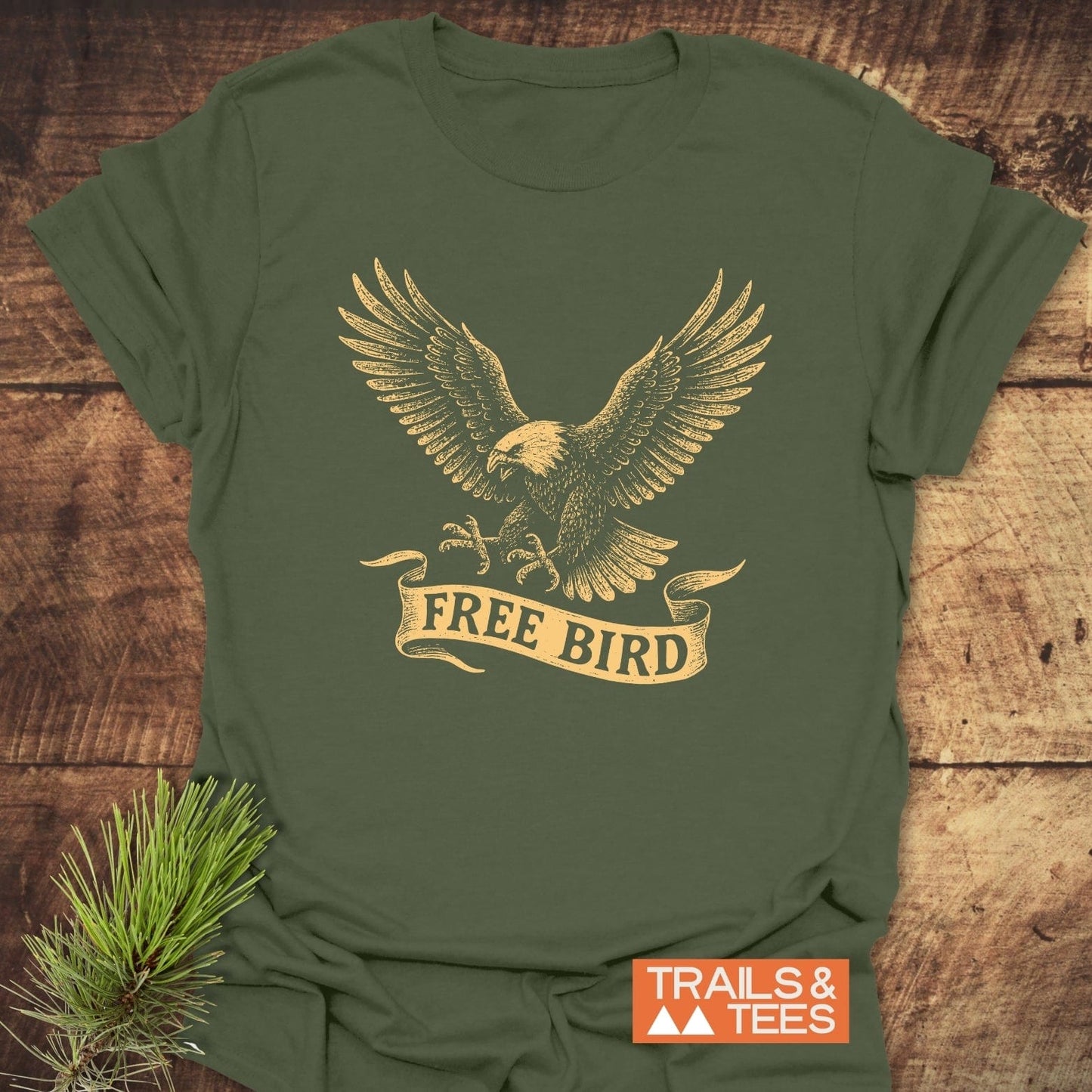 Free Bird T-Shirt with a vintage eagle illustration and FREE BIRD banner, showcasing outdoor spirit. Features durable prints and pre-shrunk, soft cotton for lasting comfort.