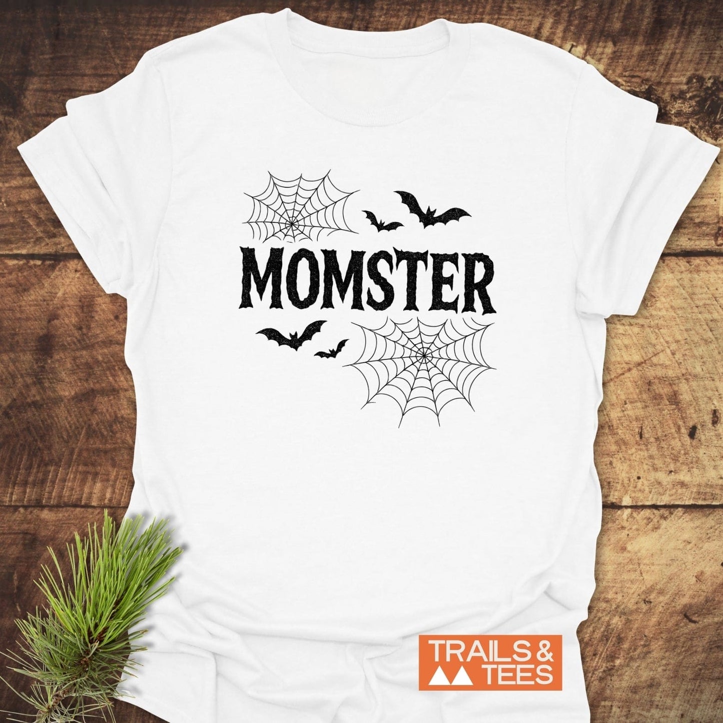 MOMSTER Halloween T-Shirt with bats and spiderwebs, crafted from soft cotton. Features durable print and pre-shrunk fit, perfect for outdoor adventures.