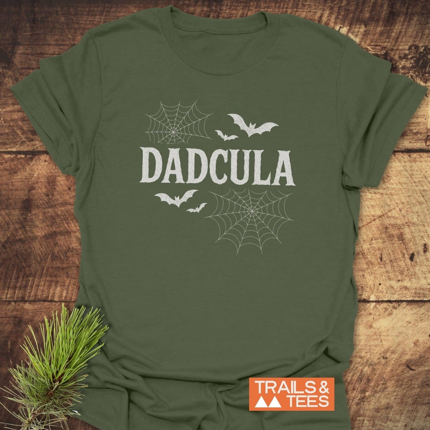 Dadcula Halloween T-Shirt with playful Dracula-inspired design, featuring spider-webs and bats. Made from soft, ring-spun cotton for comfort, perfect for outdoor adventures.