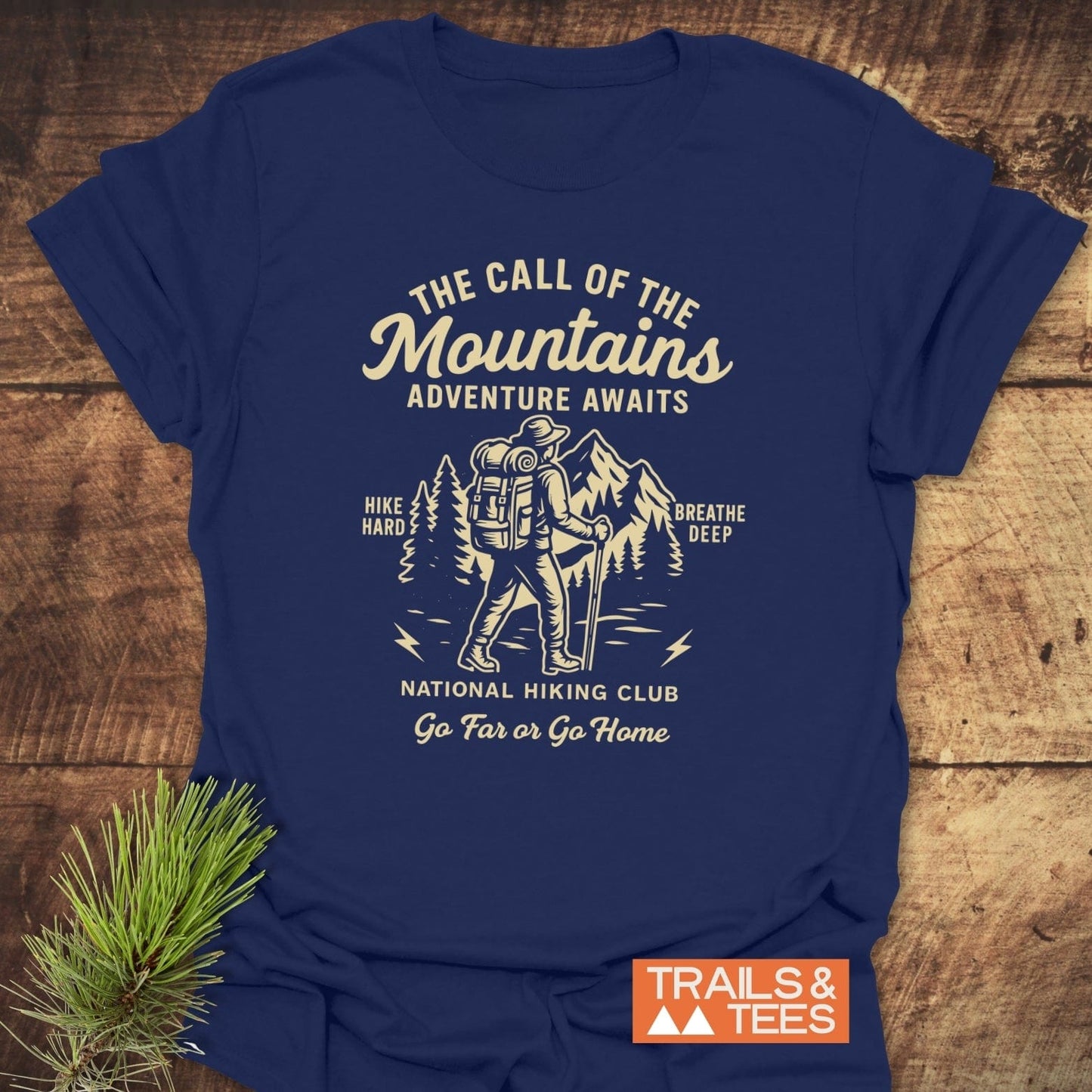 Call Of The Mountains T-Shirt featuring a hiker graphic, adventure slogans, crafted from soft cotton for comfort and durability, ideal for outdoor enthusiasts.