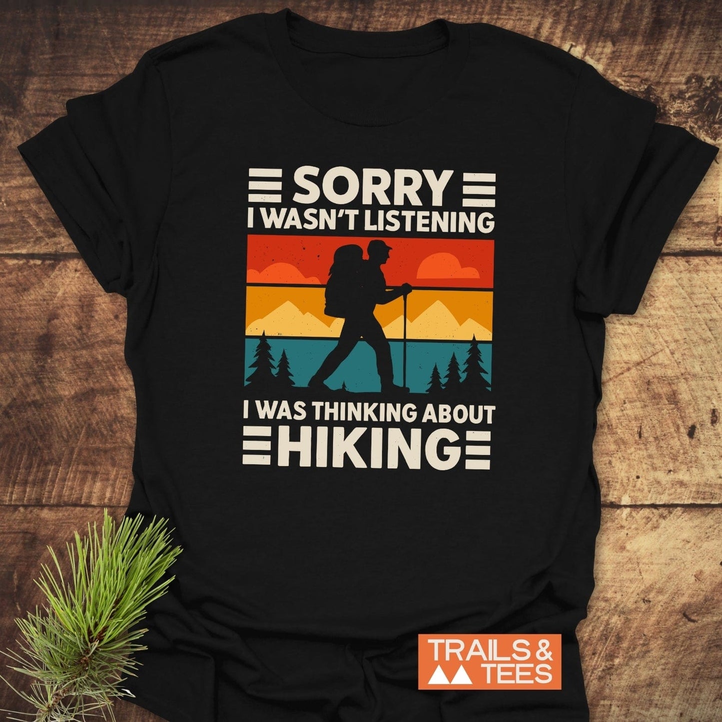 Thinking About Hiking T-Shirt with retro hiker graphic and sunset colors, made from soft ring-spun cotton, featuring durable prints and taped shoulders for lasting comfort.