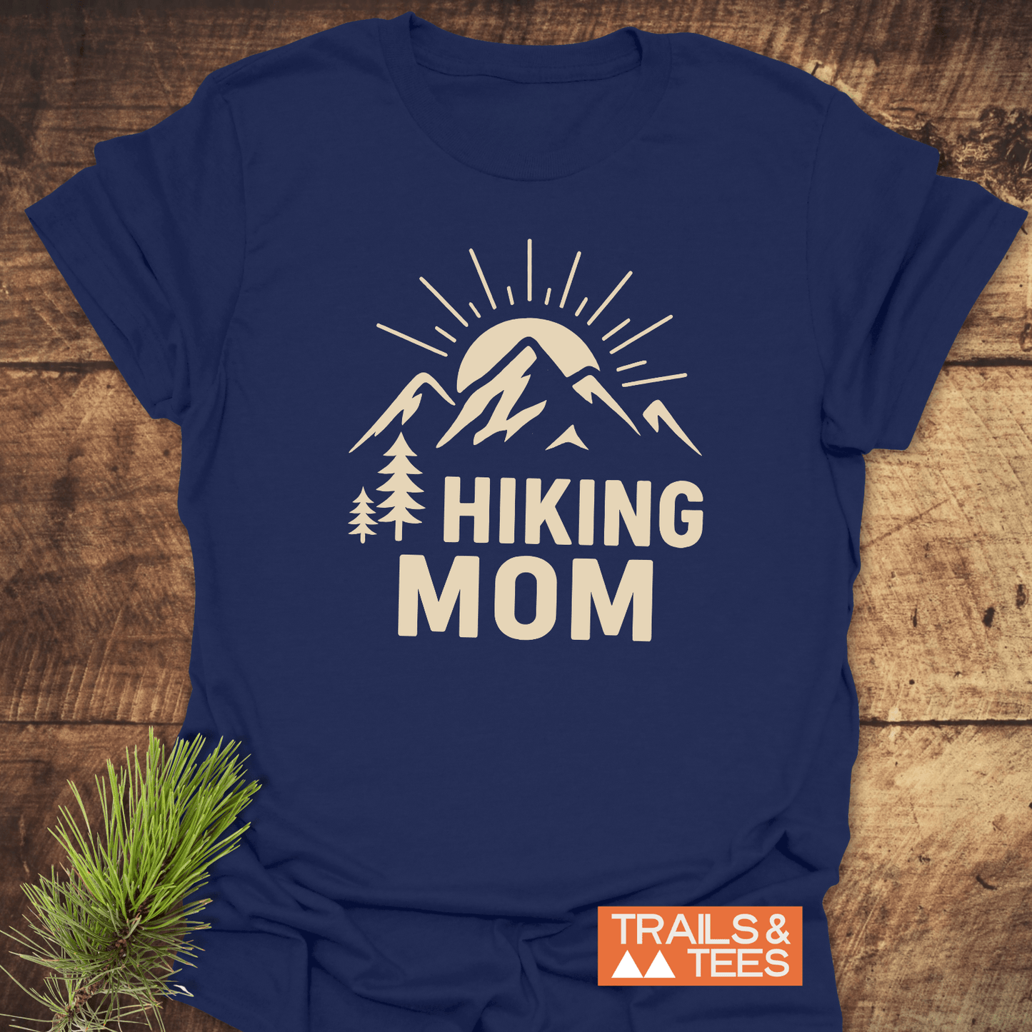 Navy tee with HIKING MOM and sunrise graphic, perfect for outdoor enthusiasts. Made from soft cotton, pre-shrunk, and durable print.