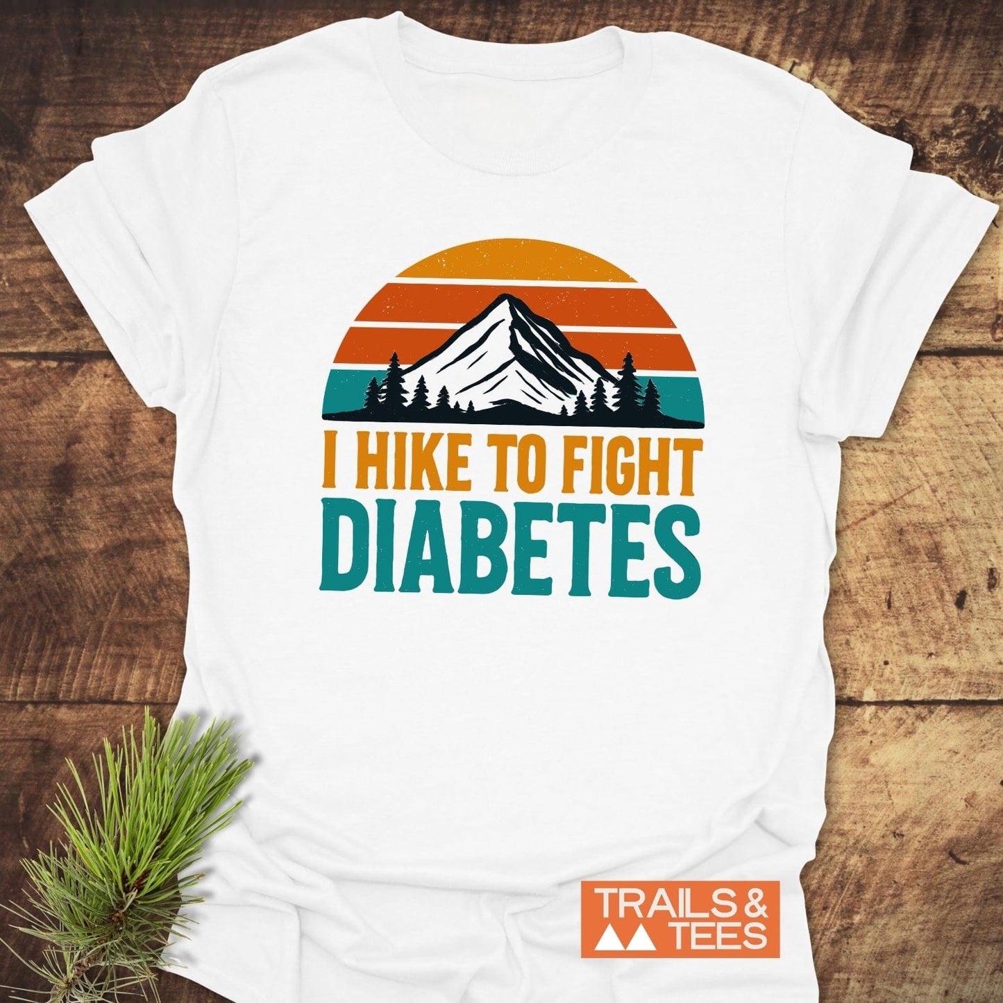 Hike To Fight Diabetes T-Shirt featuring a mountain graphic and bold text. Crafted from soft cotton with durable prints, promoting outdoor spirit and cause awareness.