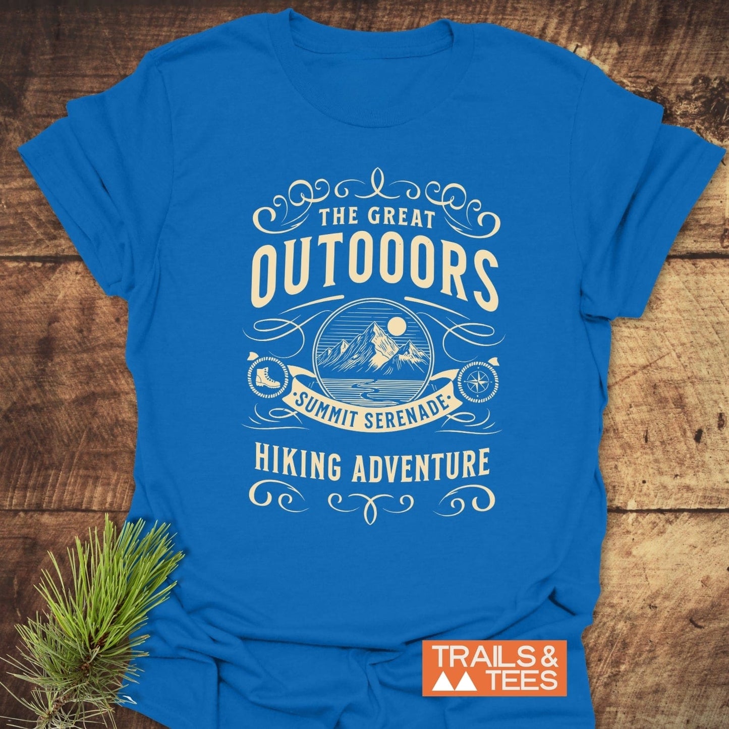 The Great Outdoors T-Shirt features a mountain design and hiking icons, emphasizing comfort and adventure with durable prints and eco-friendly production.