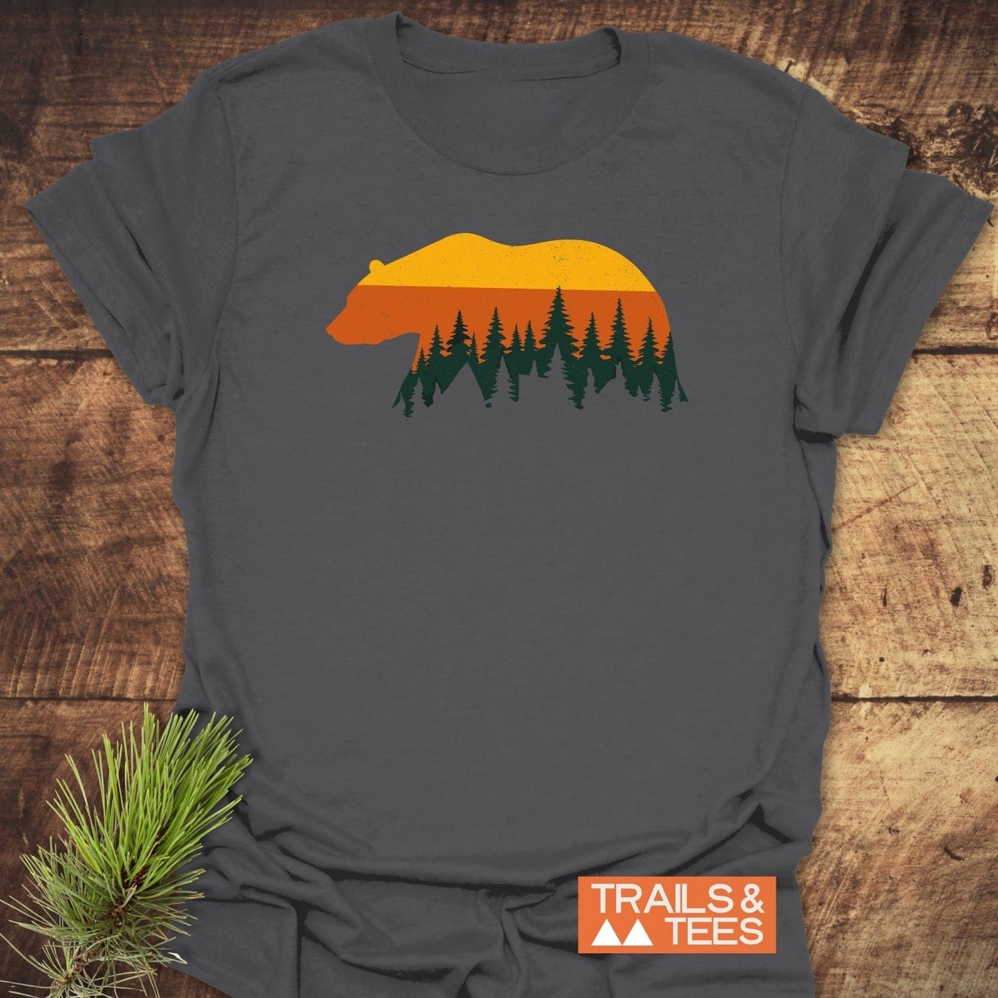 Vintage Grizzly Sunset T-Shirt featuring a bear silhouette with sunset bands and pine trees, made from soft cotton for comfort and durability.