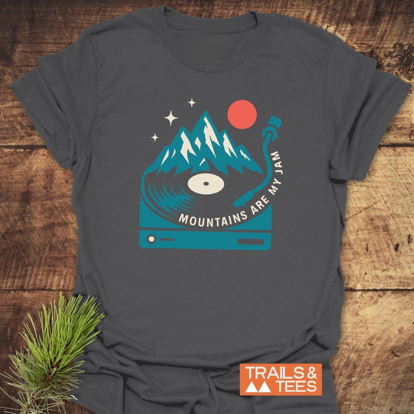 Mountains Are My Jam T-Shirt featuring a turntable-mountain graphic and slogan, showcasing rustic charm and outdoor spirit on a soft, durable ring-spun cotton tee.