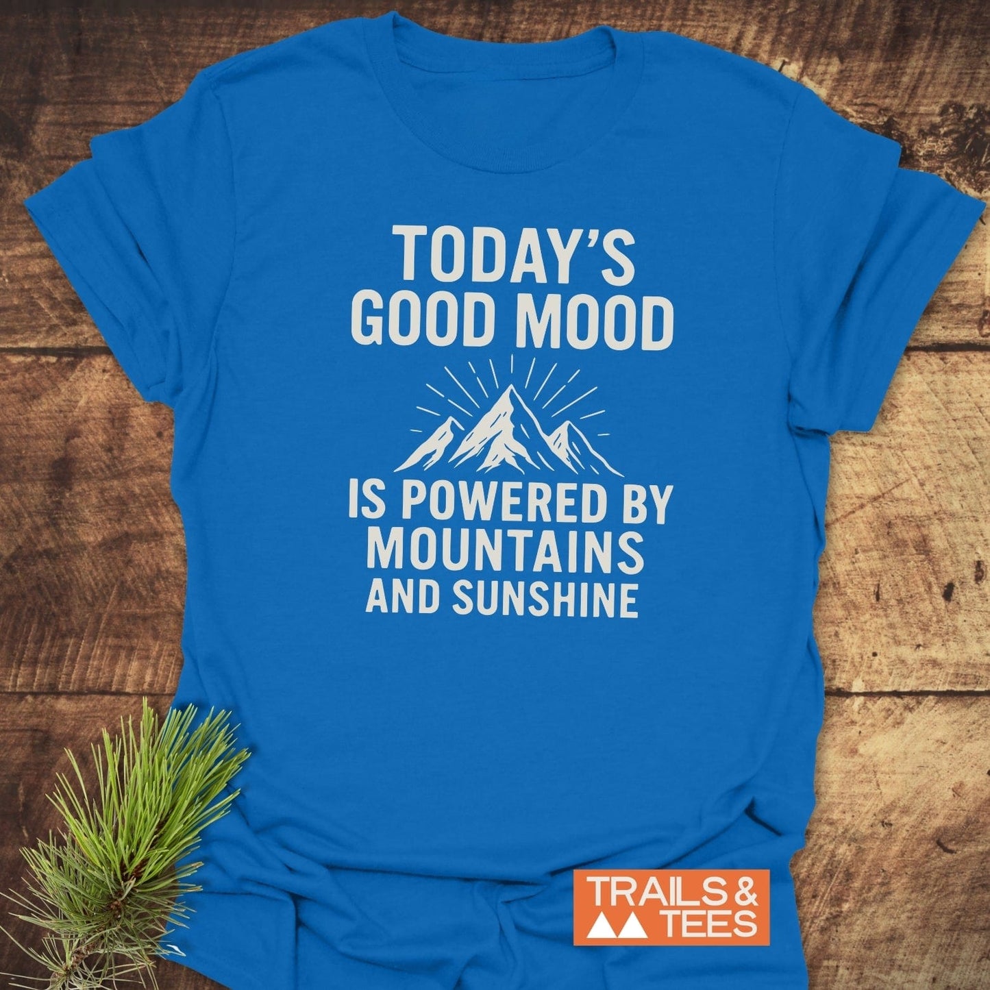Powered By Mountains T-Shirt with white mountain graphic and slogan, featuring durable prints and soft, lightweight cotton for outdoor enthusiasts.