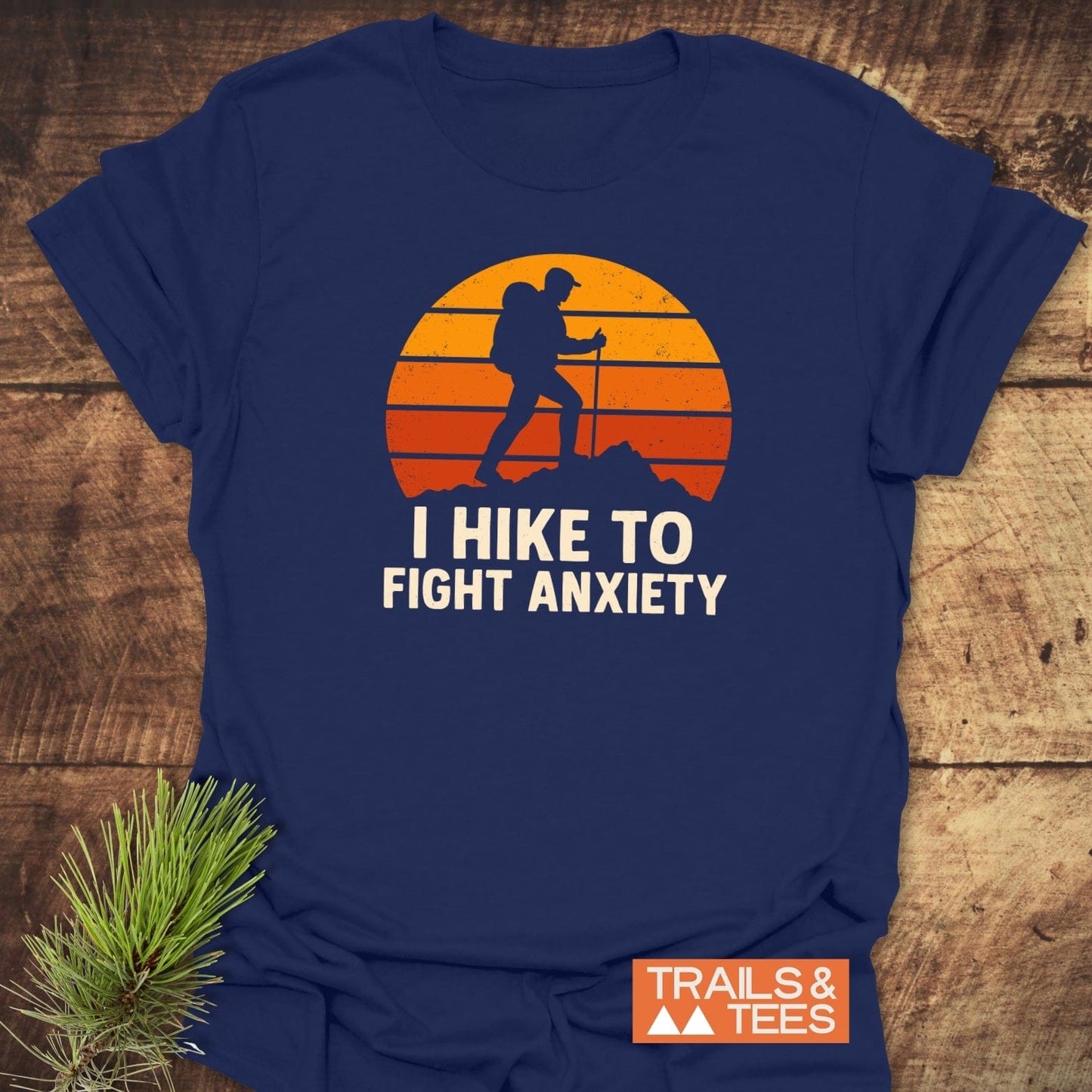 Hike To Fight Anxiety T-Shirt featuring a hiker silhouette against a sunset. Made from soft ring-spun cotton, designed for comfort and durability.