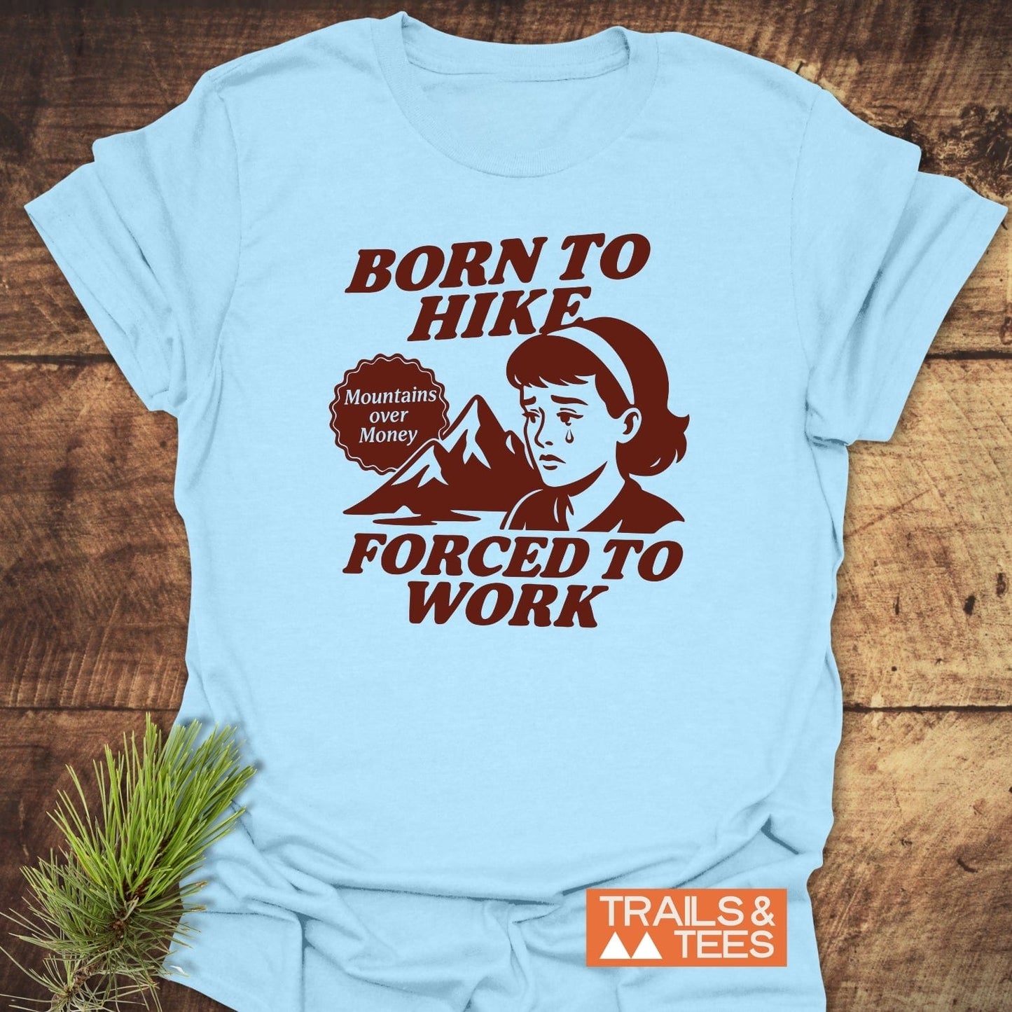 Born To Hike T-Shirt displaying a retro graphic of a hiker, crafted from ring-spun cotton for comfort, with durable prints and a reliable fit.