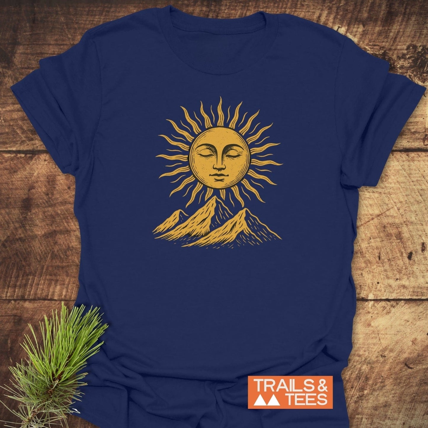 Sun And Mountains Boho T-Shirt with a stylized sun graphic above mountains, showcasing outdoor adventure spirit. Comfortable, durable, and pre-shrunk for reliable fit.