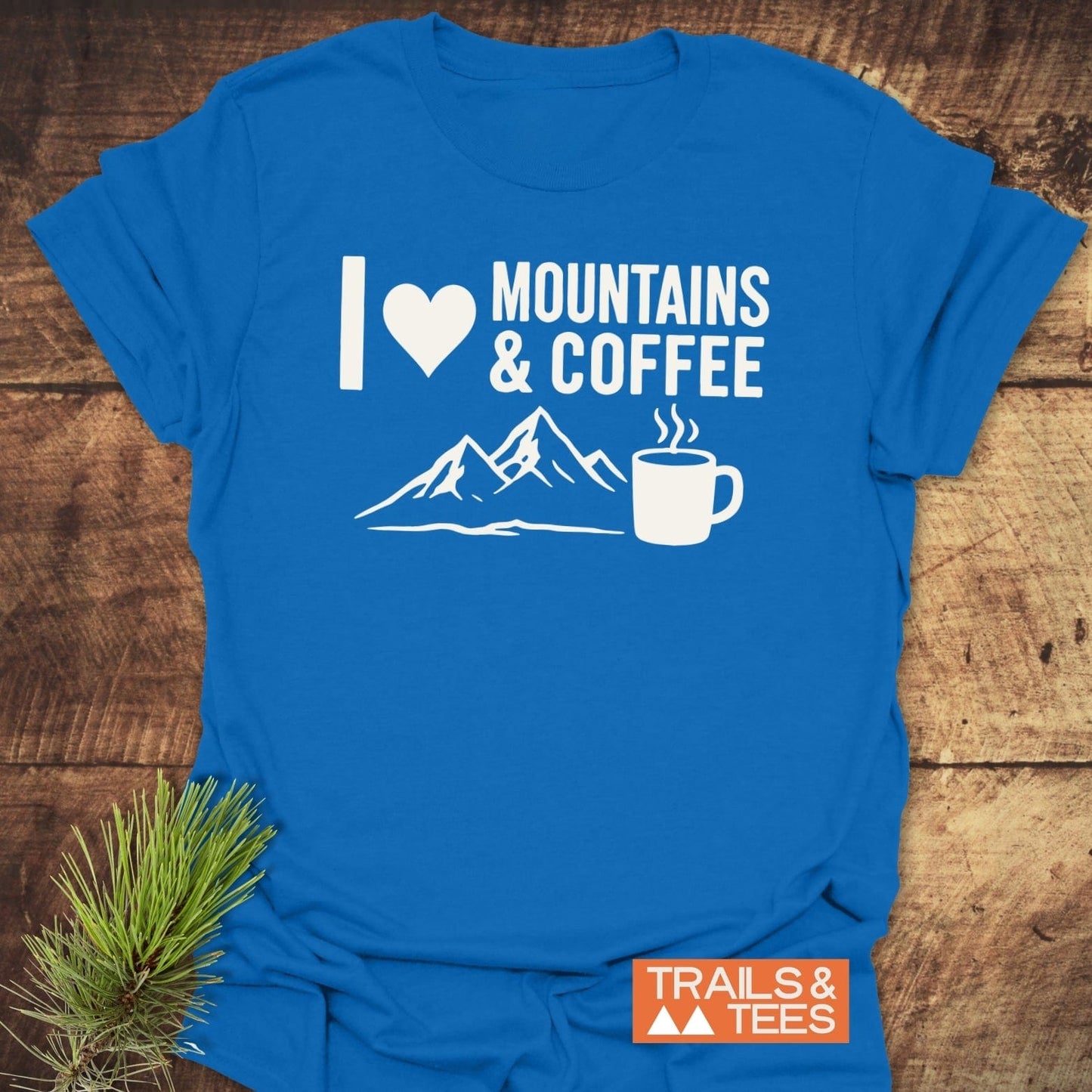 I love Mountains And Coffee T-Shirt with mountain and coffee mug graphic, crafted from soft cotton for comfort and durability, ideal for outdoor enthusiasts.