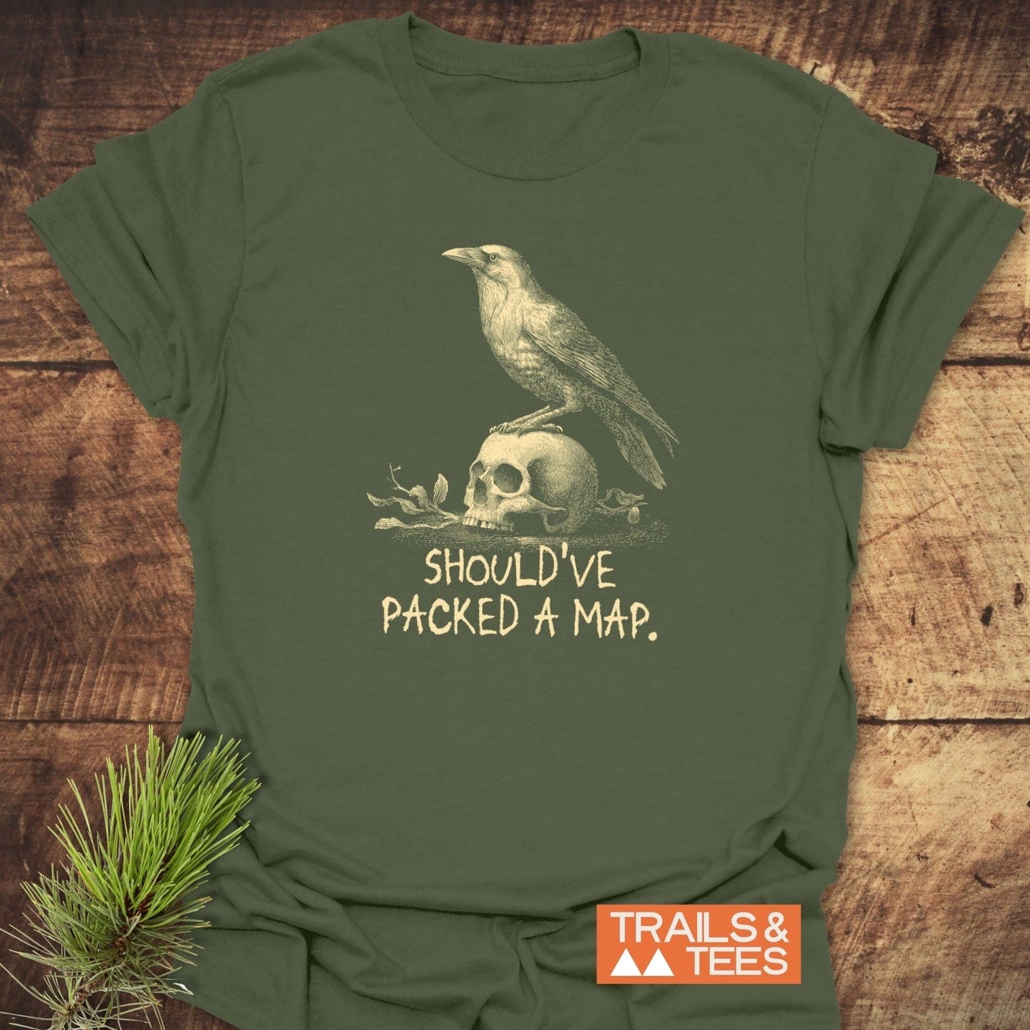 No Wi-Fi Funny T-Shirt: Olive-green tee featuring a vintage crow-skull illustration and slogan, crafted from soft cotton for comfort and durability, with a Trails & Tees logo.
