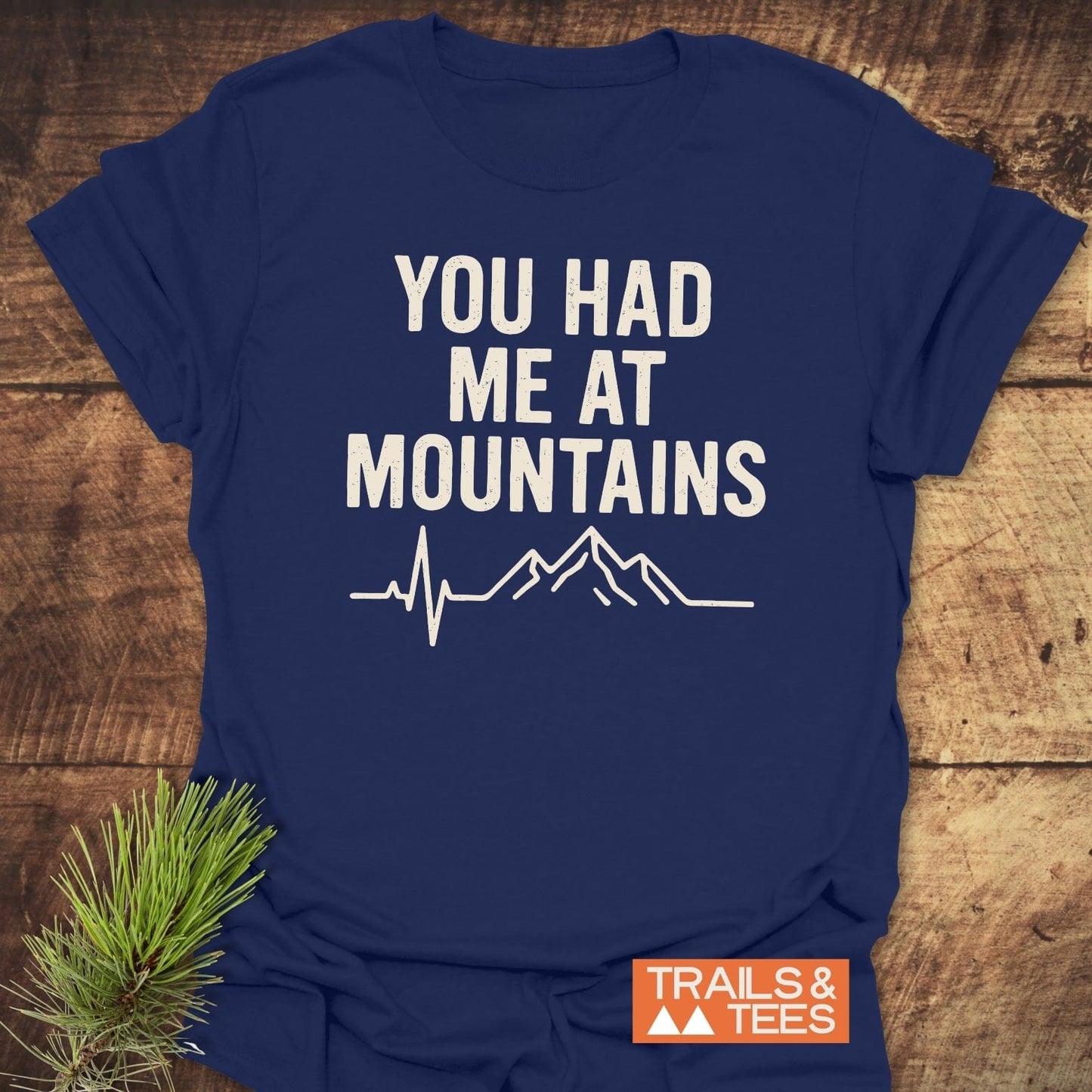 You Had Me At Mountains T-Shirt with mountain silhouette and heartbeat line, showcasing durable print and soft cotton for outdoor enthusiasts.