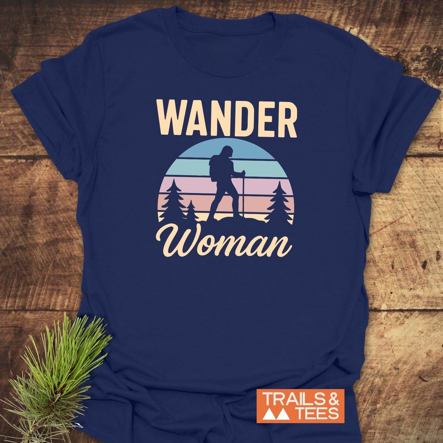 Wander Woman Retro T-Shirt featuring a vintage sunset graphic with a hiker silhouette. Made of soft ring-spun cotton, ideal for outdoor adventures.