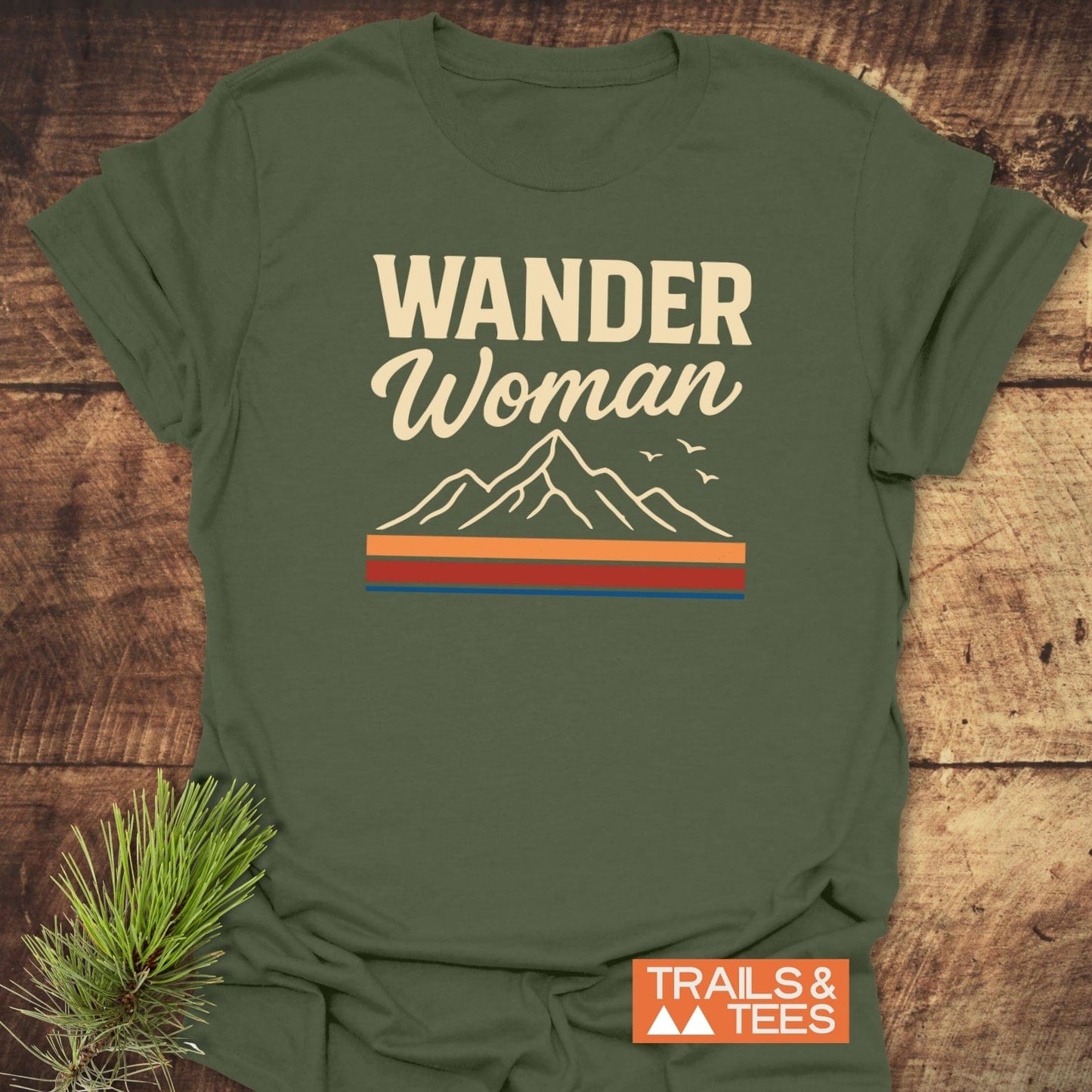 Wander Woman Graphic T-Shirt, featuring mountain art and birds, offers trail-tested comfort with soft, pre-shrunk cotton, showcasing durable prints for outdoor enthusiasts.