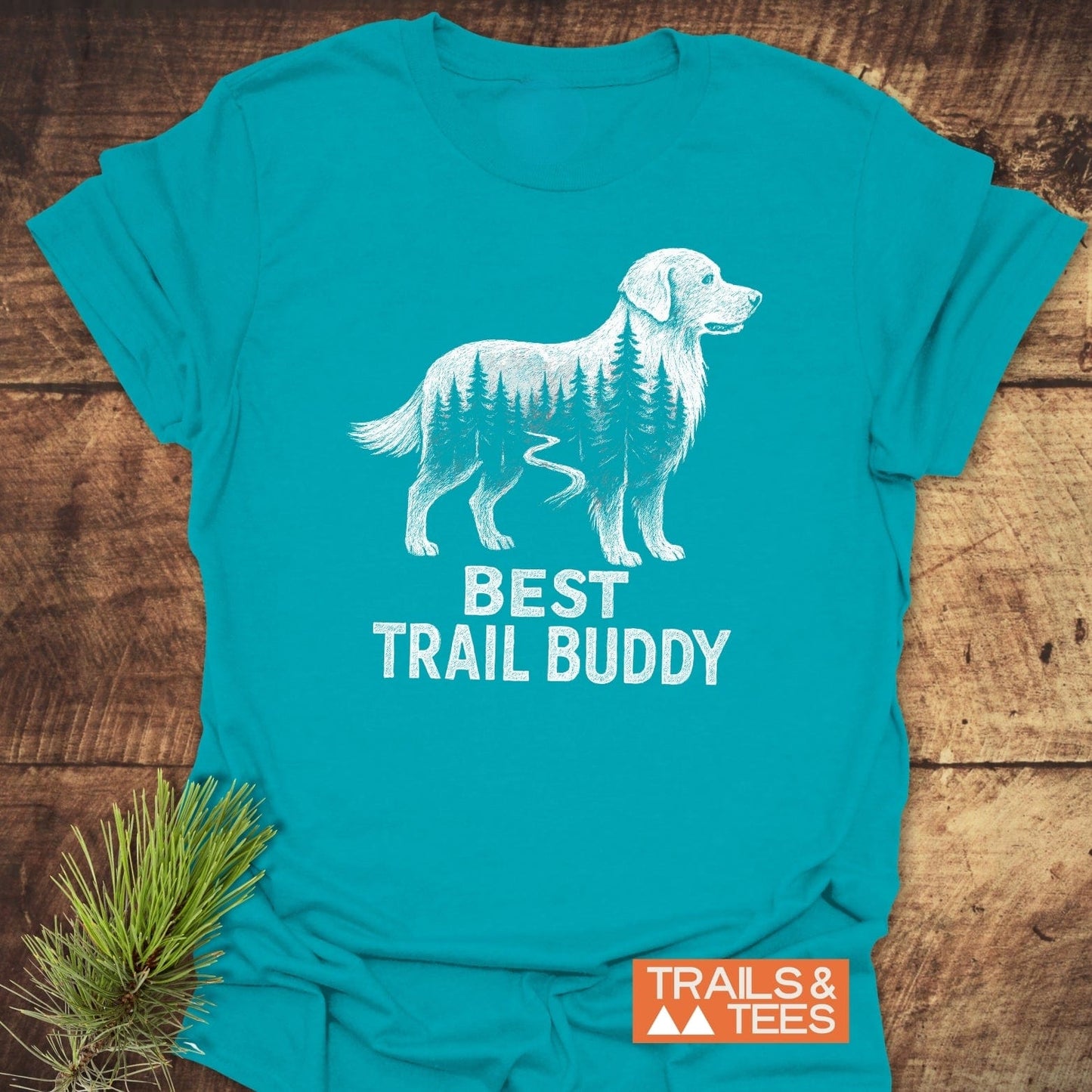Best Trail Buddy Golden Retriever T-Shirt featuring a forest-filled retriever graphic, slogan, and TRAILS & TEES logo, crafted for comfort with durable, fade-resistant prints.