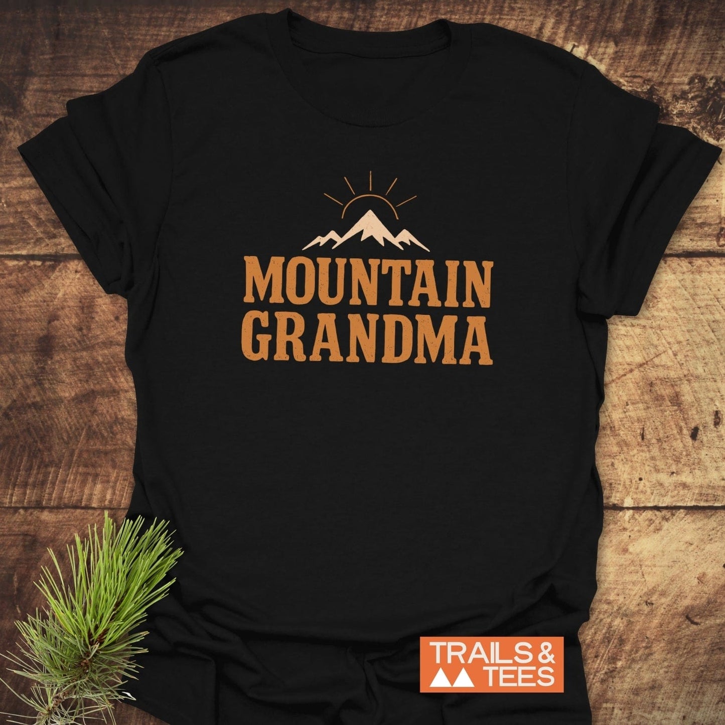 Black T-shirt with Mountain Grandma and mountain graphic, made of soft cotton, designed for outdoor enthusiasts, featuring durable prints and eco-friendly production.
