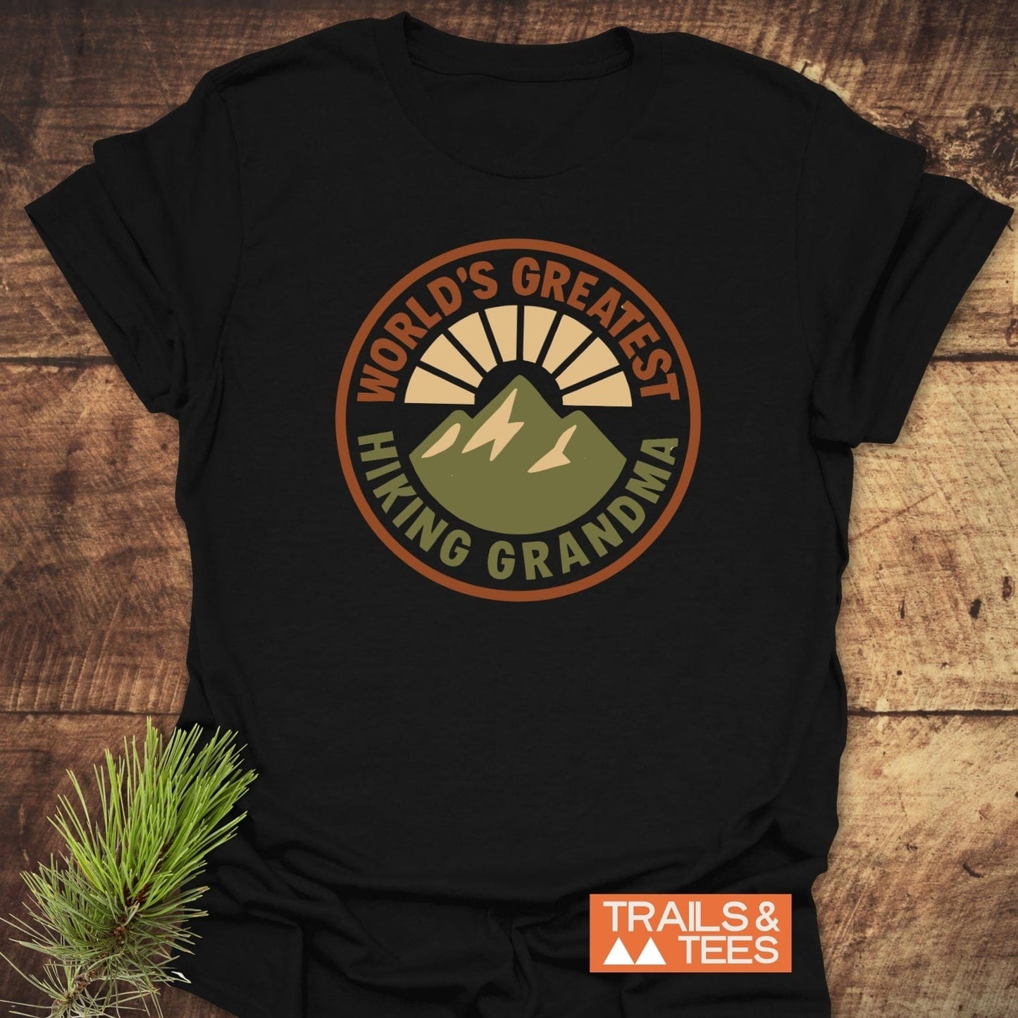 Greatest Hiking Grandma T-Shirt featuring a mountain sunrise graphic, crafted from soft cotton, designed for comfort and durability, with a sustainable print-on-demand approach.